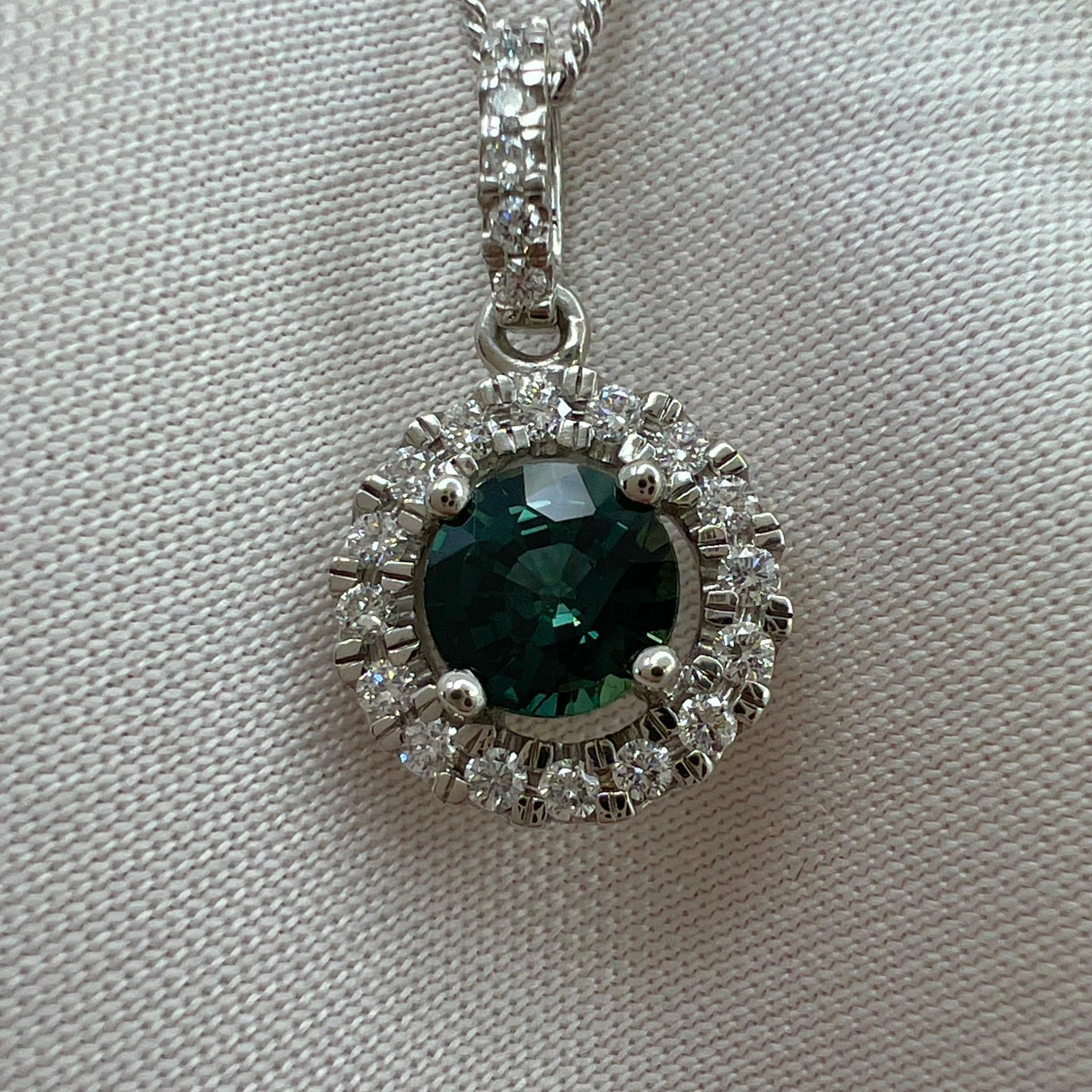 Natural Teal Green Blue Round Cut Australian Sapphire & Diamond Platinum Halo Pendant.

0.63 Carat centre sapphire with a fine deep green-blue teal colour and excellent clarity, very clean gem. Measures 5mm. Also has an excellent round cut. Fine top