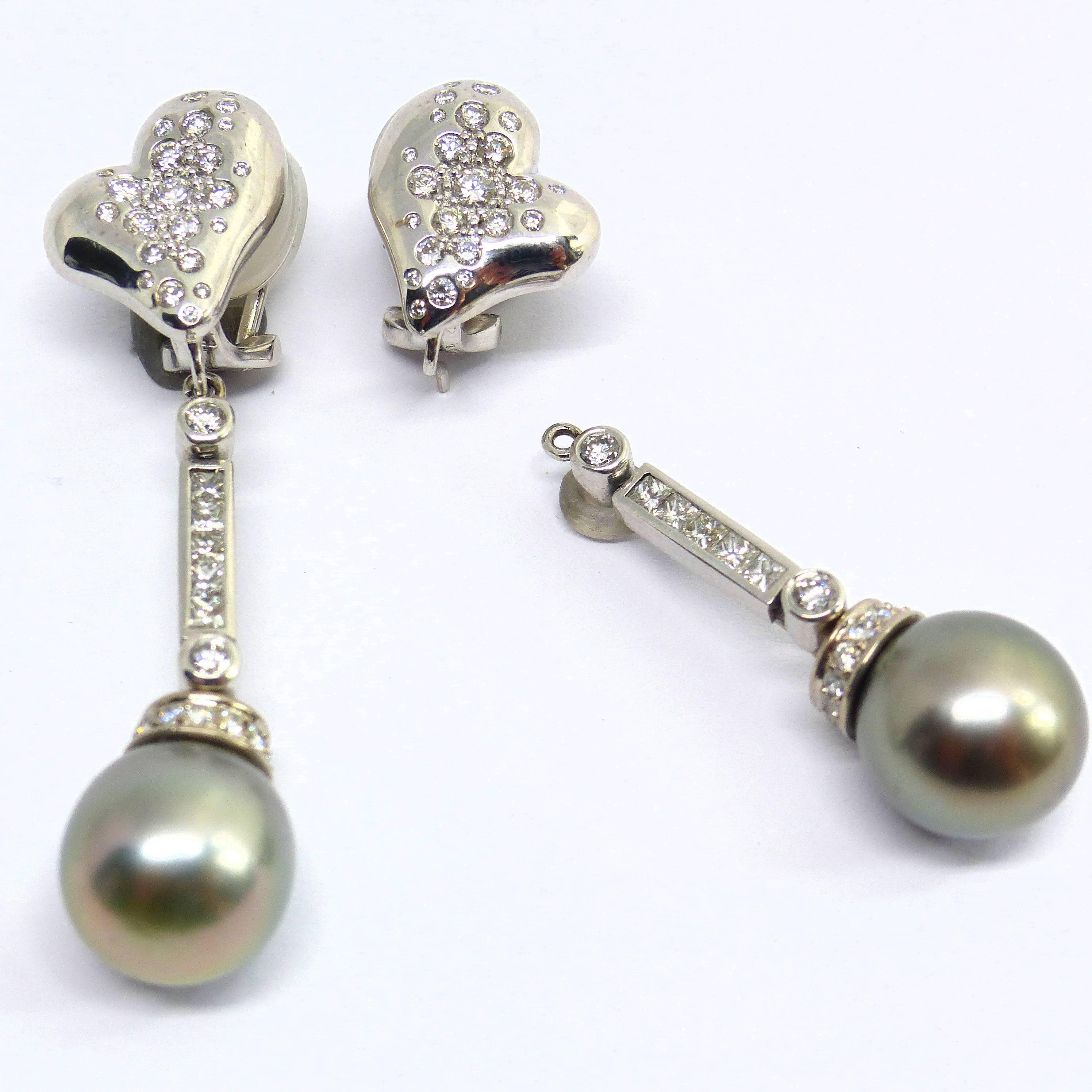 Thomas Leyser is renowned for his contemporary jewellery designs utilizing fine gemstones. 
		
This 18k white gold (24,65gr.) pair of earrings is set with 2 top quality Thaiti pearls 12mm + 70 diamonds brillant cut round 1 - 1,8mm, 1,29cts., G(VS) +