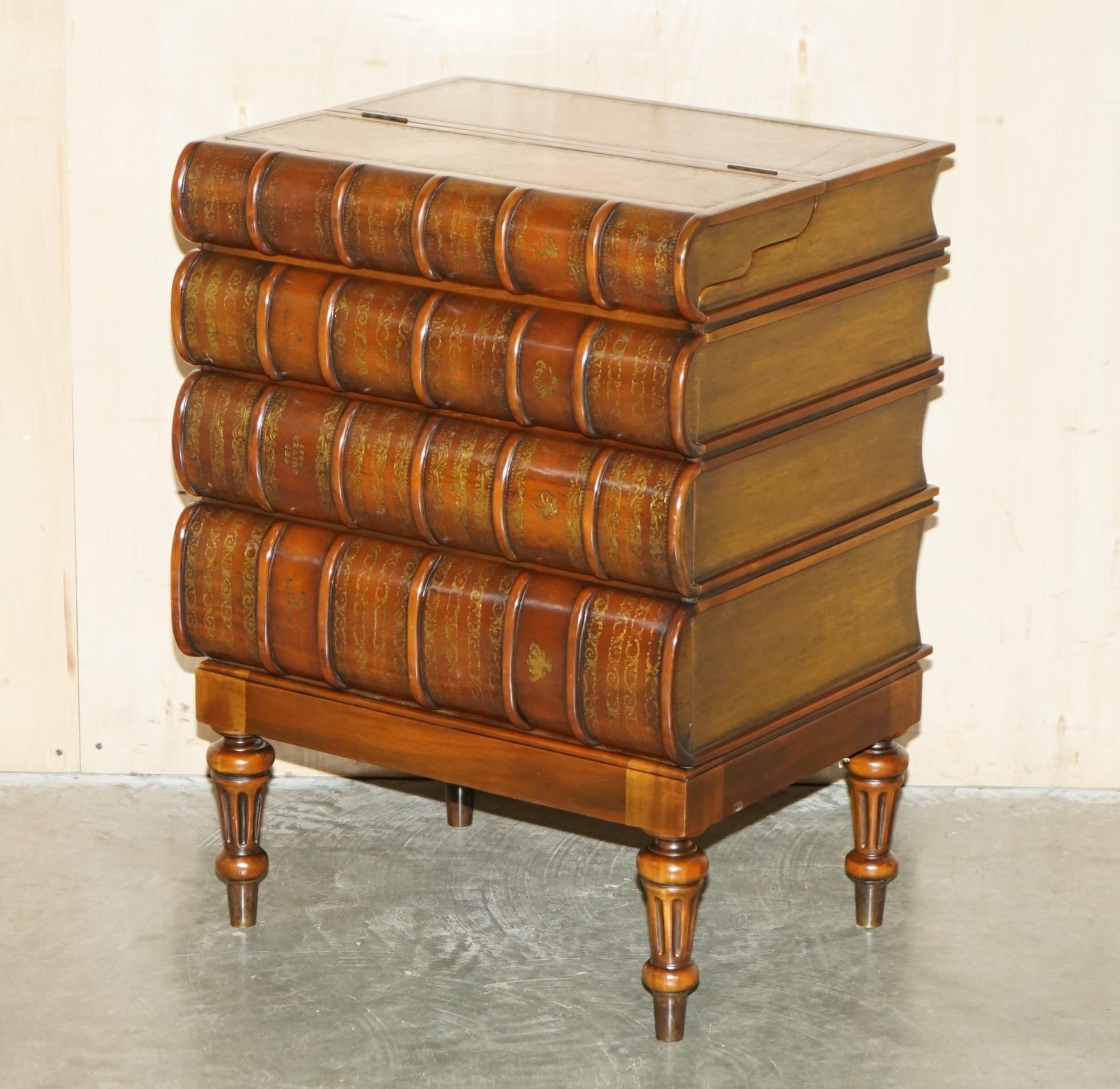 Royal House Antiques

Royal House Antiques is delighted to offer for sale this super rare, custom made to order Theodore Alexander Faux book chest of drawers with lift up brown leather writing bureau top 

Please note the delivery fee listed is just