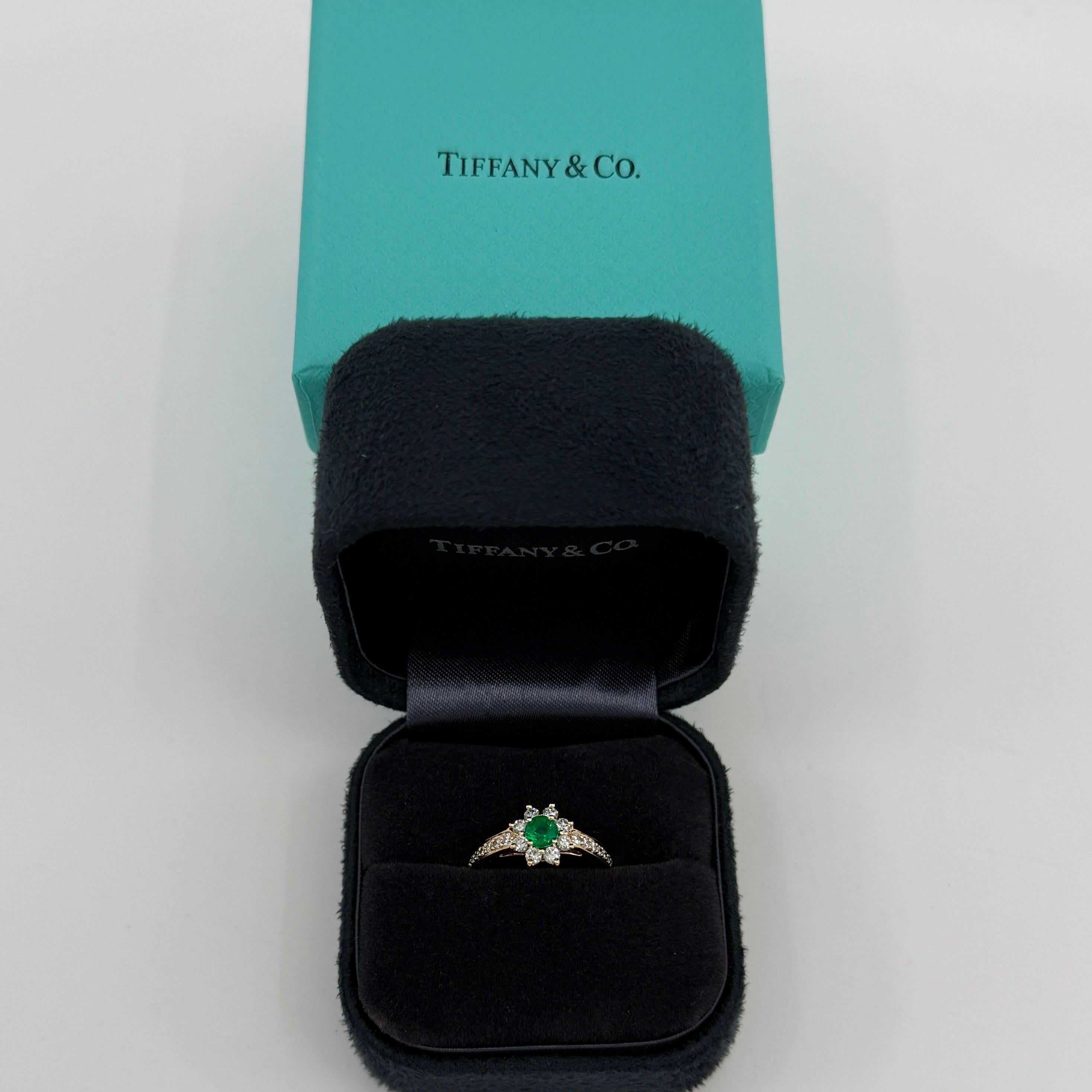 Rare Vintage Tiffany & Co. Emerald & Diamond Buttercup 18k Yellow Gold Ring.

A beautifully made yellow gold cluster ring set with a stunning 4mm vivid green round cut emerald. Superb colour, clarity and cut. Colour looks much better in person than