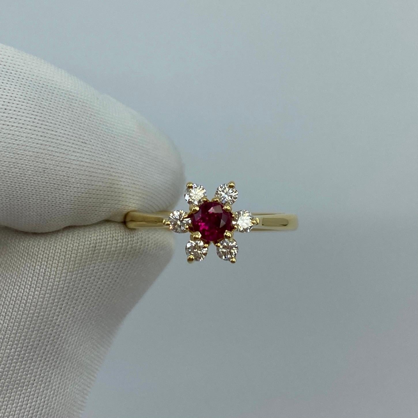 Rare Tiffany & Co. Ruby & Diamond Buttercup 18k Yellow Gold Ring.

A beautifully made yellow gold cluster ring set with a stunning 3.3mm (approx. 0.33ct) deep red round cut ruby. Superb colour, clarity and cut. Surrounded by 6 white diamonds 2.2mm