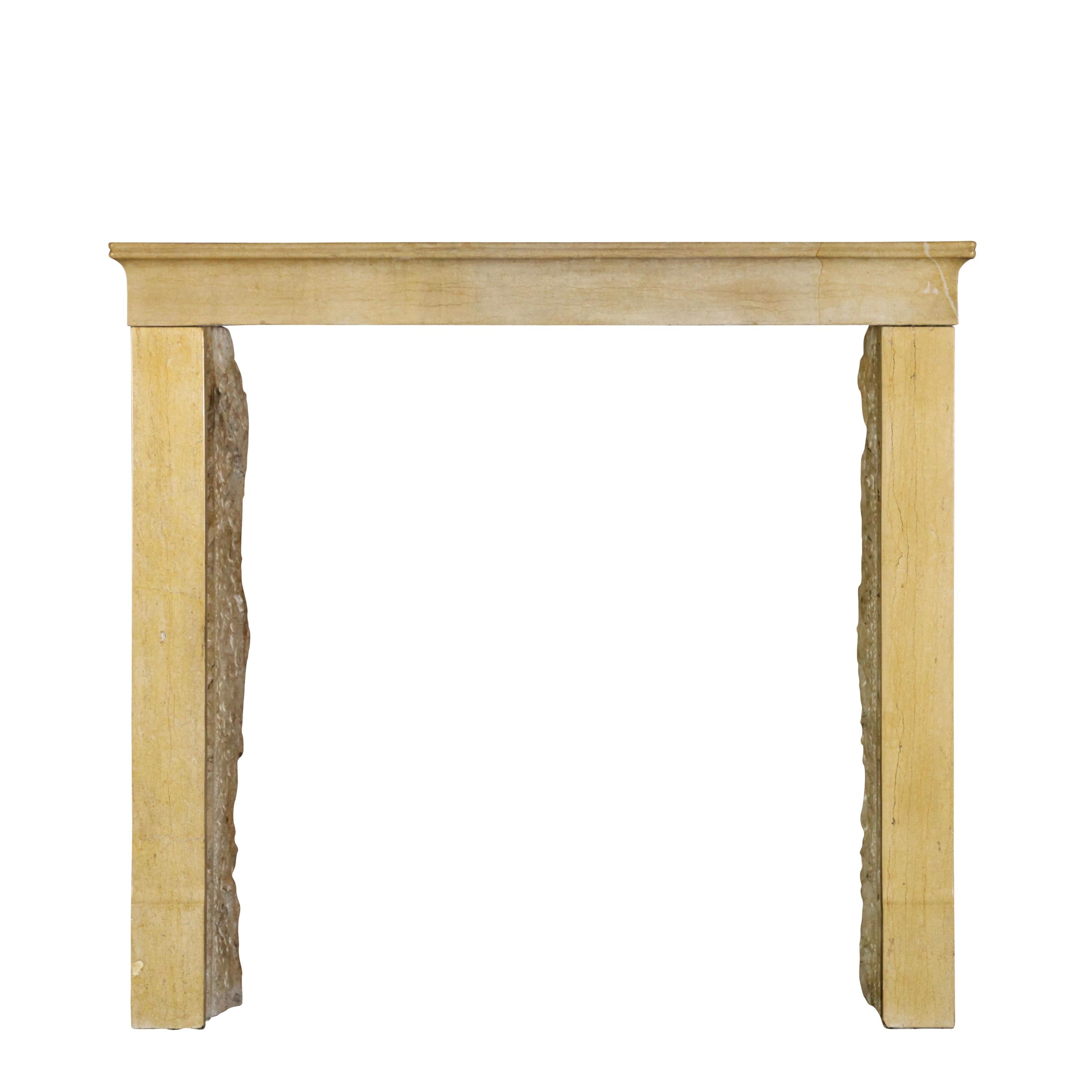 A 19th century French elegant mantle. This is a petite original antique fireplace surround. A typical petite bourguignon in it typical honey color hard stone from that region. Dijon. Perfect to create a cosy room with a timeless, eclectic