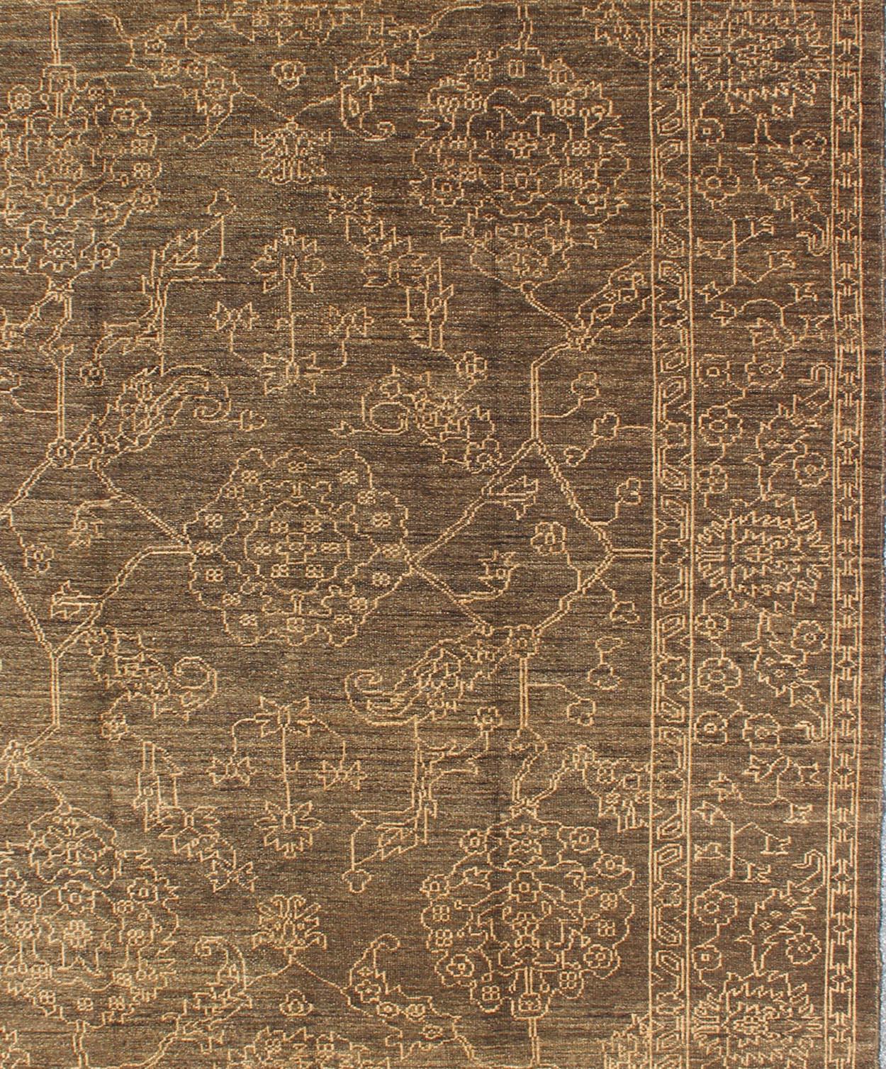 Light brown and very finely woven Transitional rug in the brown background of light blue highlights, Keivan Woven Arts, rug AN-115307, country of origin / type: Turkey / Tribal

This Turkish rug features a transitional design of stylized motifs in