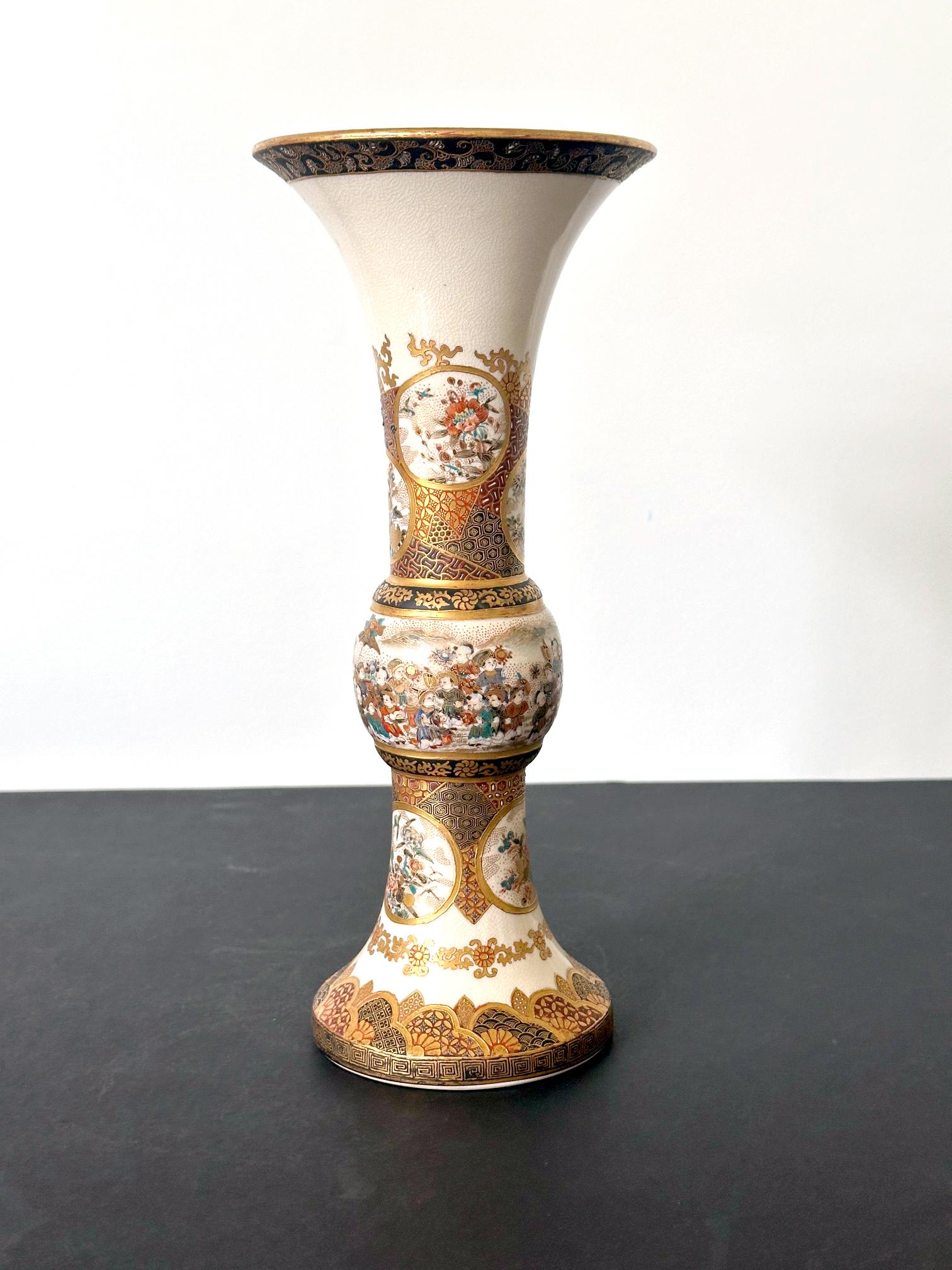 A tall ceramic satsuma ware vase in a rare slender trumpet form with very fine surface decoration by Japanese potter Taizan Yohei IX (1864-1922). The vase was dated to late Meiji period circa 1890-1900s. 
The main motif and the focal point of the