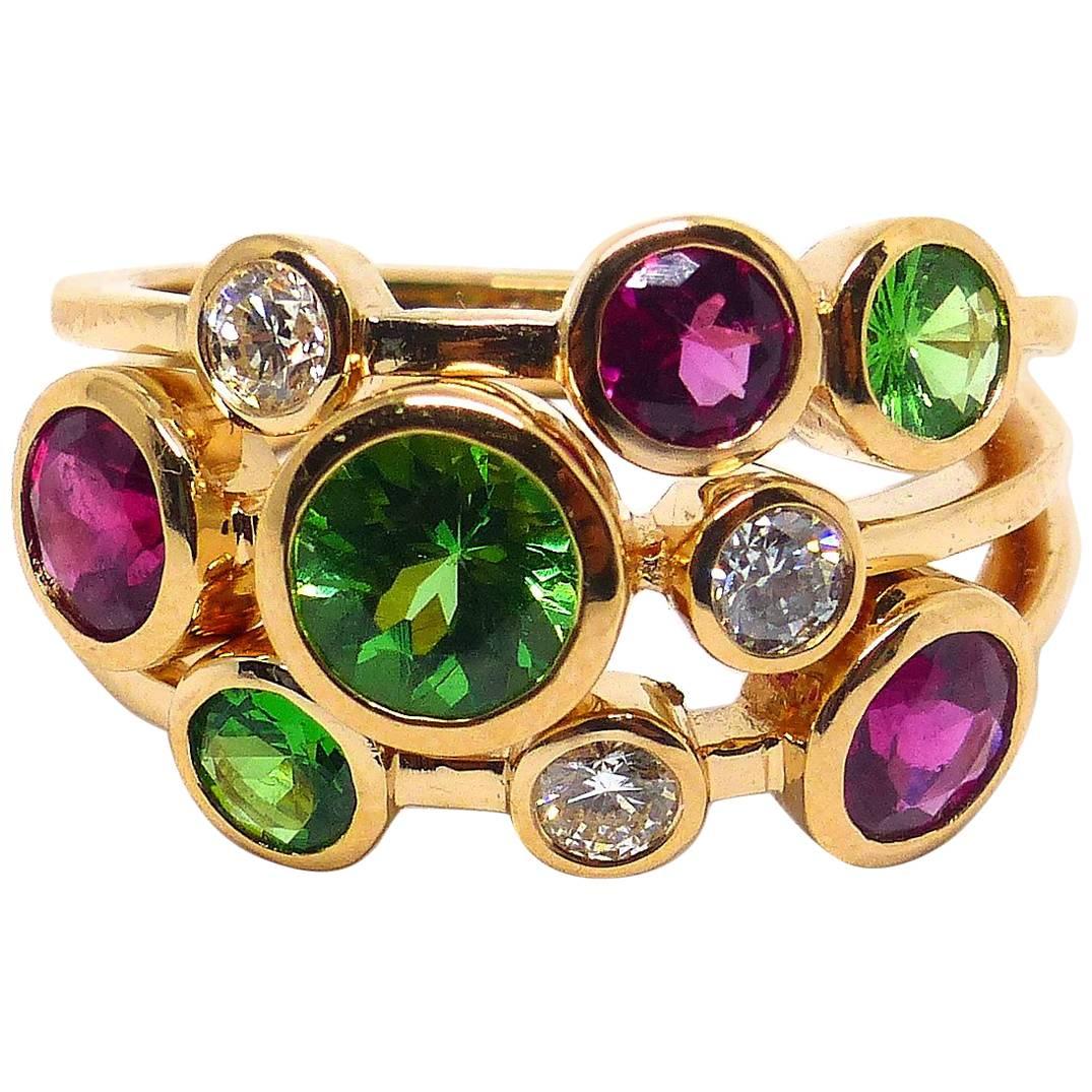 Ring in Rose Gold with Tsavorite and Rubelites and Diamonds.