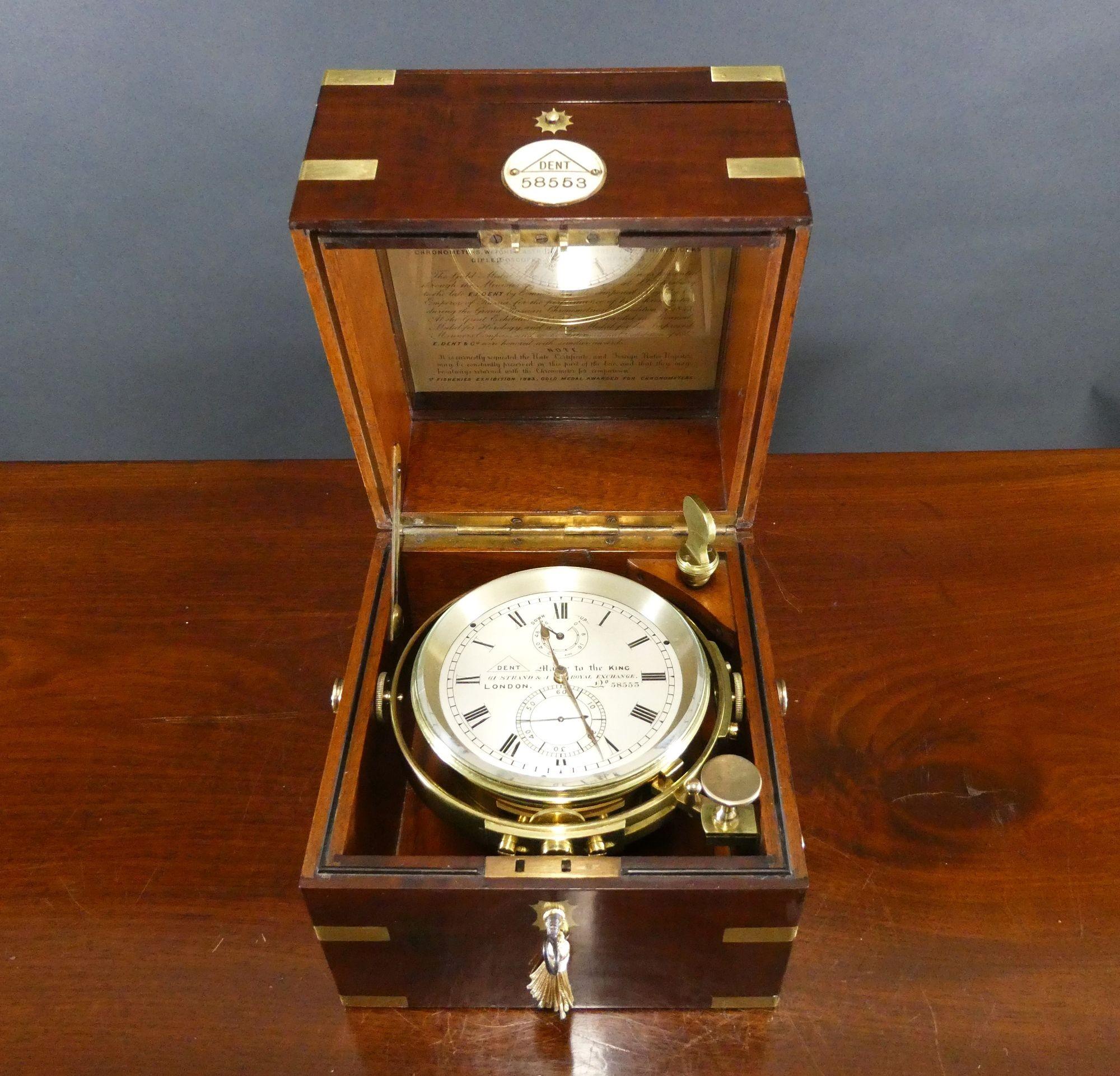 A Fine Two Day Marine Chronometer By Dent, London No.58553

Two day marine chronometer by Dent housed in a beautiful three tier mahogany brass bound box with inset carrying handles to the sides, inset plaque to the front carrying the Dent trademark