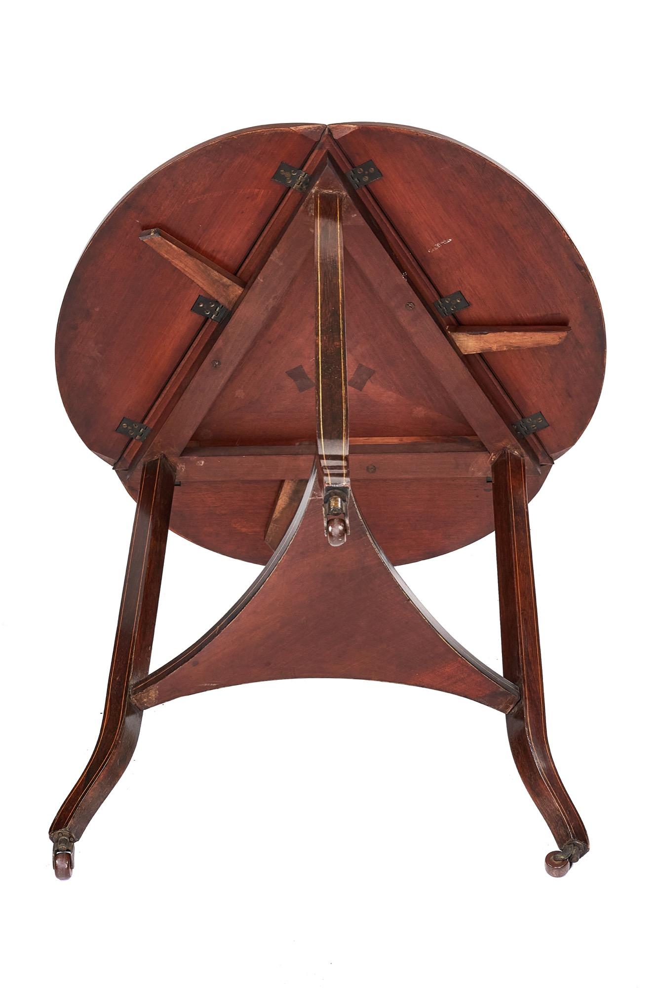 Fine Edwardian rosewood inlaid drop leaf table having an unusual triangular shape, the top boasts a pretty centre inlay with bone and satinwood decoration, the three drop leafs having the same delightful inlay depicting urns, foliage and scrolls.