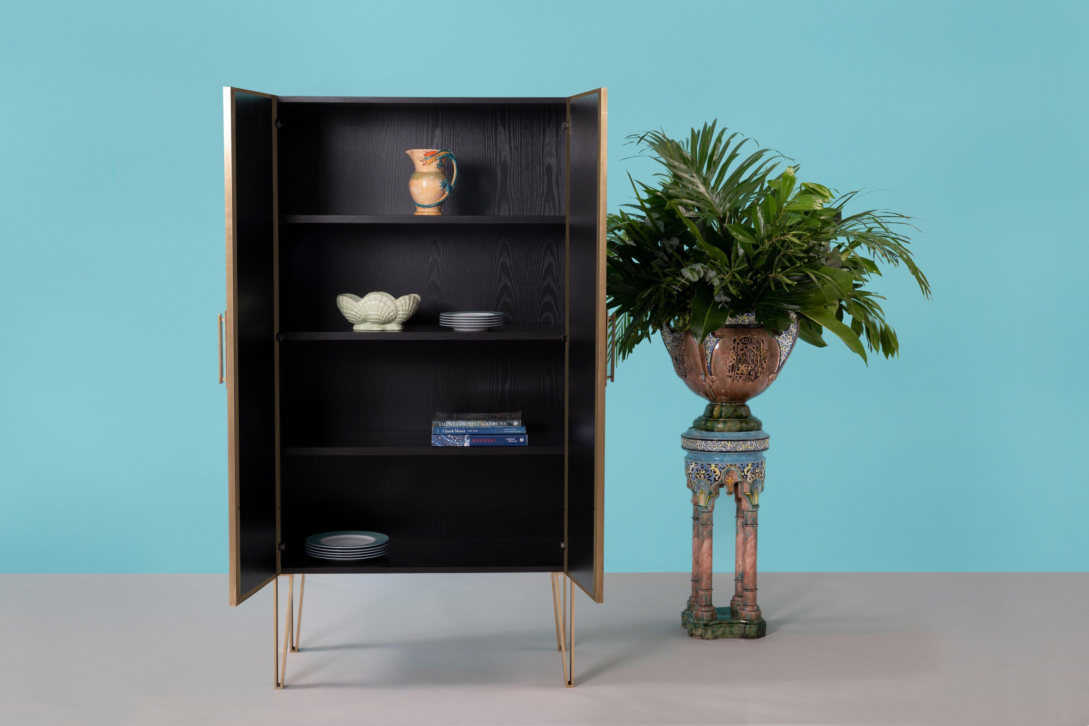 Fine Upholstered in FELDER FELDER’s stunning electric blue print, the Cordelia cabinet is a bold, confident choice for any interior.

Handcrafted in England from lacquered oak wood, this statement piece is upholstered in sumptuous silk-blend satin