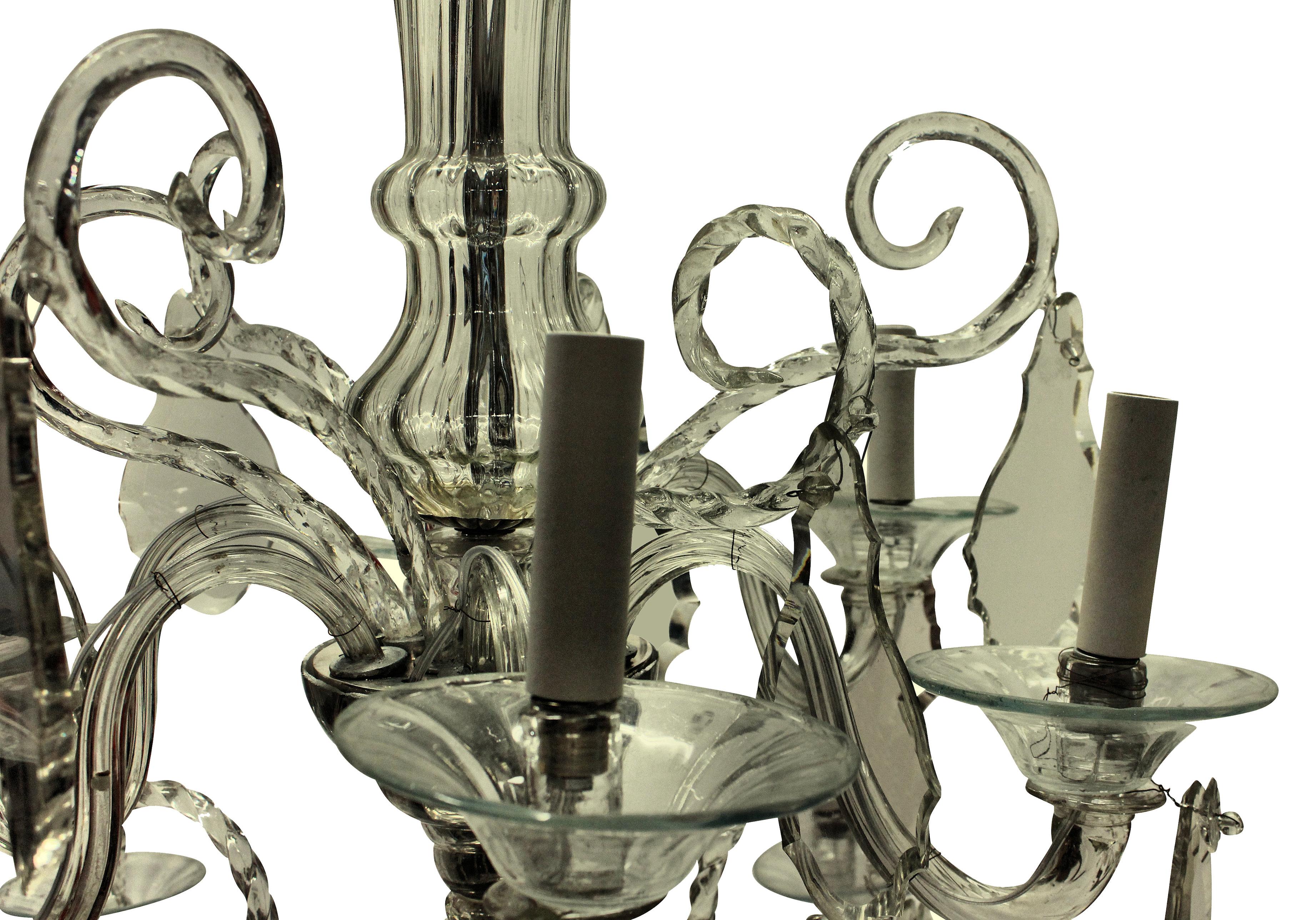 A fine Venetian chandelier, in hand blown glass, comprising two tiers of lights, with mirrored glass dishes.