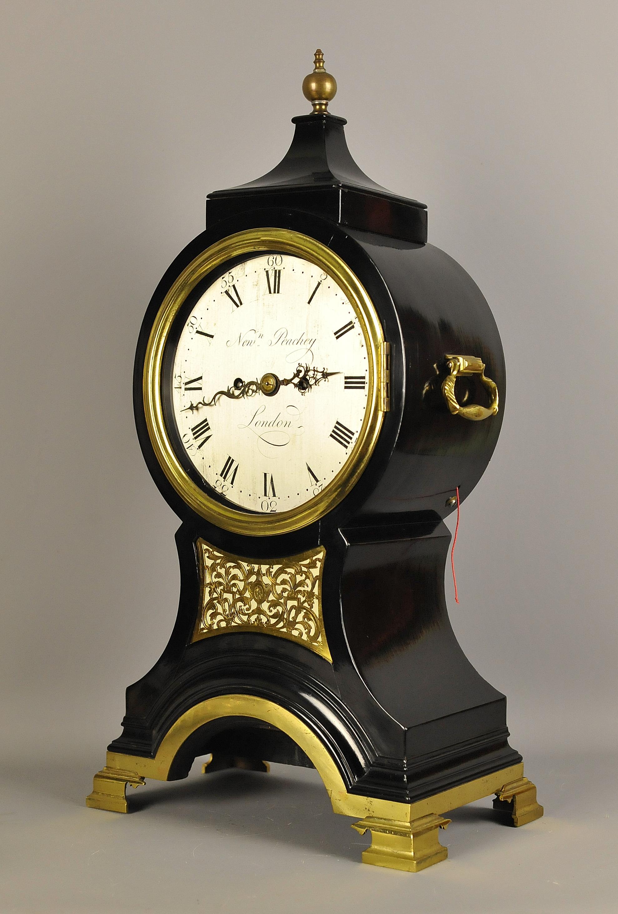 This is a fine ebonized English balloon clock dating from the Georgian period made by Newman Peachy who worked from Dean Street London circa from 1749 until his death in 1802. This clock will date circa 1780
This earlier style of balloon clock is