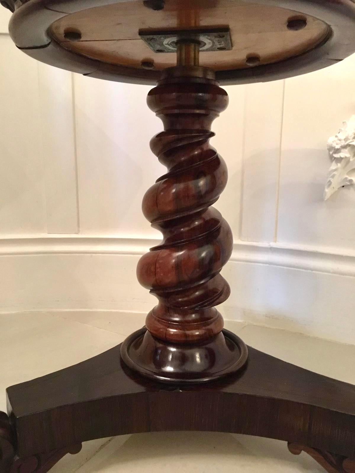 Fine Victorian carved walnut revolving piano stool having the original leather circular revolving seat, supported by a wonderful finely carved twist centre column and raised on three elegant shaped and finely carved cabriole legs and terminating