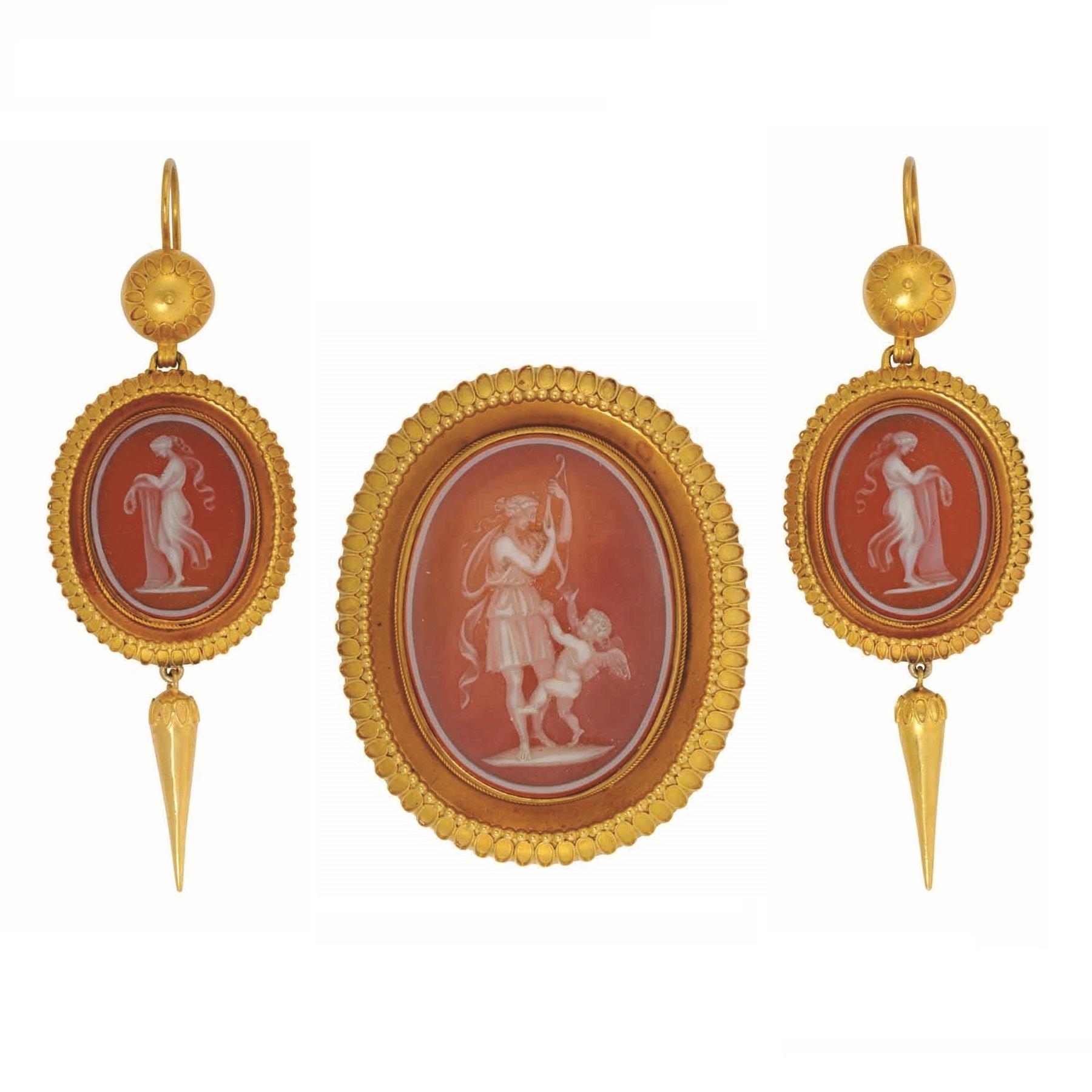 A Victorian cameo and gold suite by Joseph Mayer, the brooch set to the centre with an oval cameo measuring approximately 32 x 24 mm, the earrings each set with a cameo measuring approximately 19 x 14 mm, suspended to a domed top with sheperd's hook