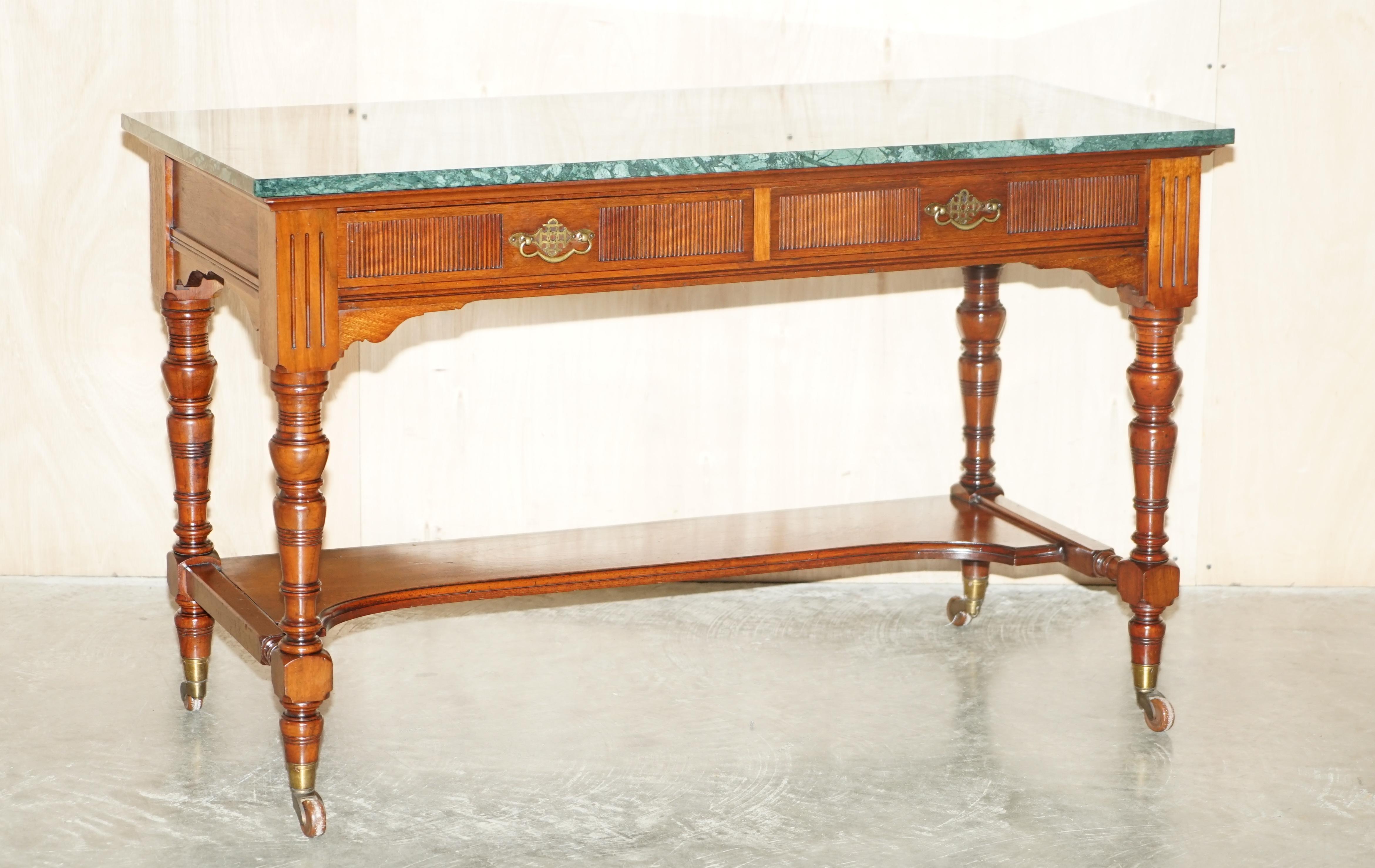 We are is delighted to offer for sale this absolutely stunning original Victorian circa 1880 James Jas Shoolbred Watchmakers table / desk with green marble top 

A good looking and well-made piece, the timber frame is late Victorian and has a