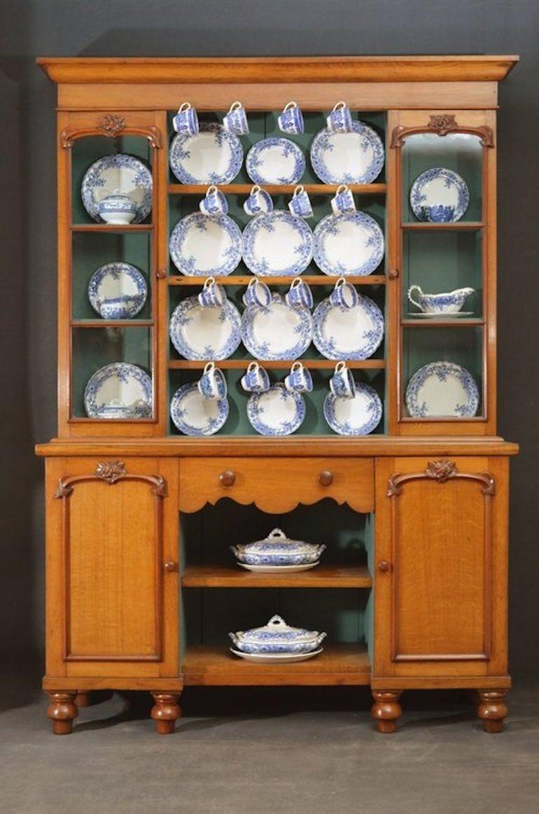 Sn2923a An attractive Victorian oak dresser, having outswept cornice above 3 shelves fitted with cup hooks, flanked by glazed, moulded and carved doors, moulded top above shaped frieze drawer and shelf, all flanked by panelled cupboard doors, all