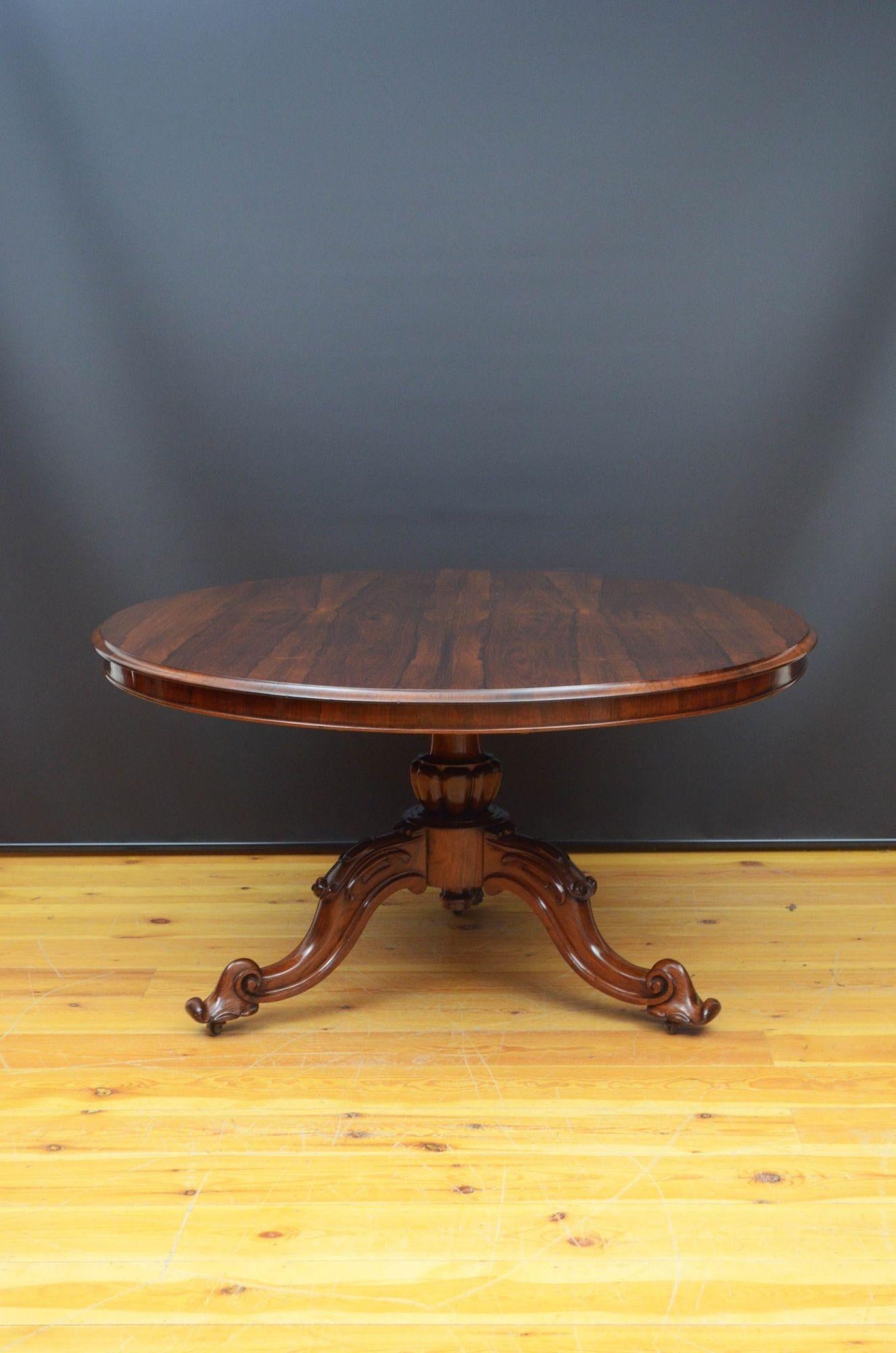 Sn5487 Fine quality and very attractive Victorian rosewood centre table, having tilt top with outstanding grain, moulded edge and shallow frieze, standing on vase shaped column with petal carved collar terminating in three carved, cabriole legs and