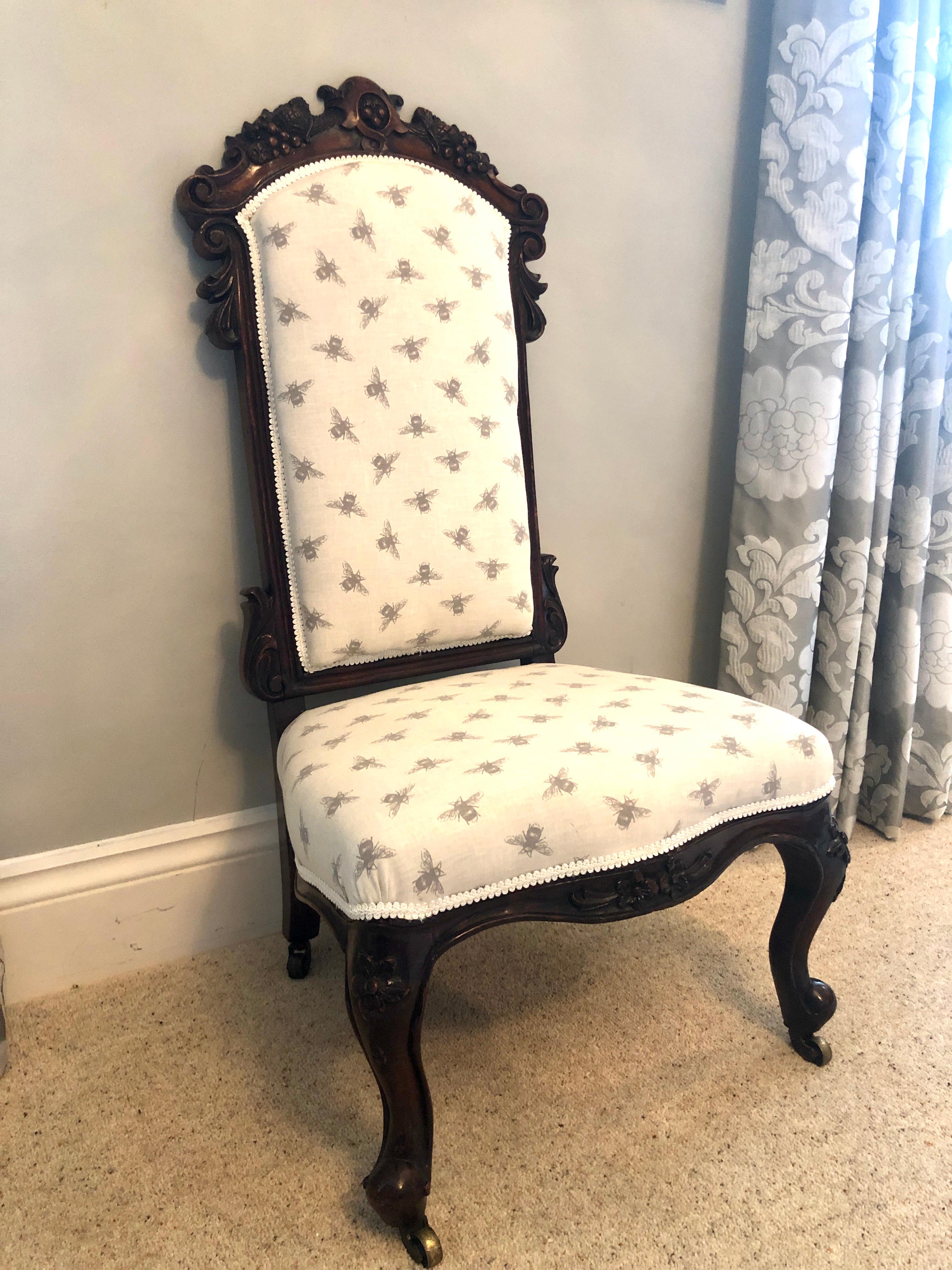 Fine antique Victorian carved rosewood ladies chair having a finely carved shaped top with carved sides and legs. This attractive chair is in perfect condition, the padded back and seat have been newly upholstered using a quality fabric. Supported