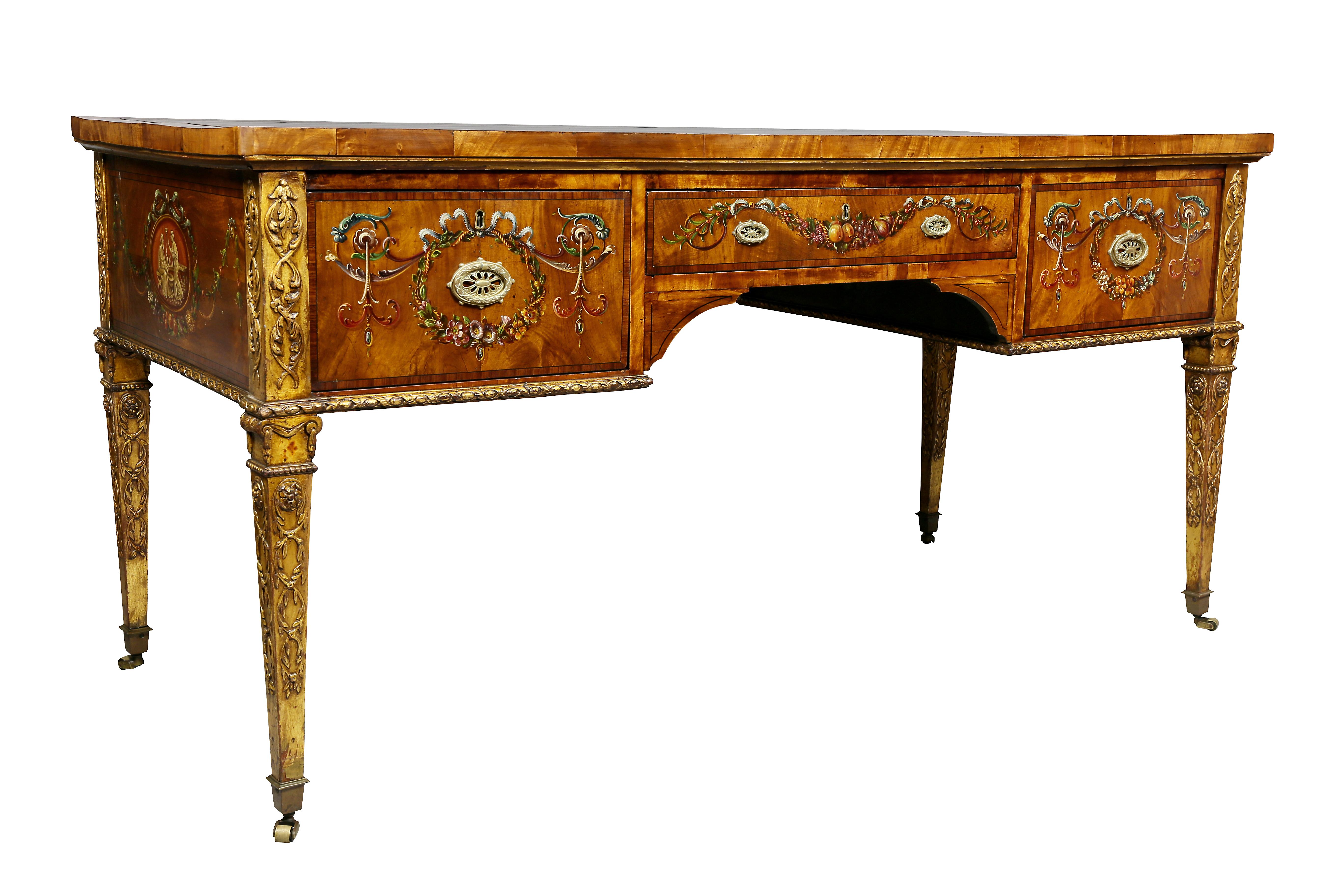 With inset tooled brown leather top with wood banded edge over a central drawer flanked by two deep drawers raised on gilded square tapered legs with carved details, casters. Most likely by Gillows of Lancaster. Beautifully painted neoclassic