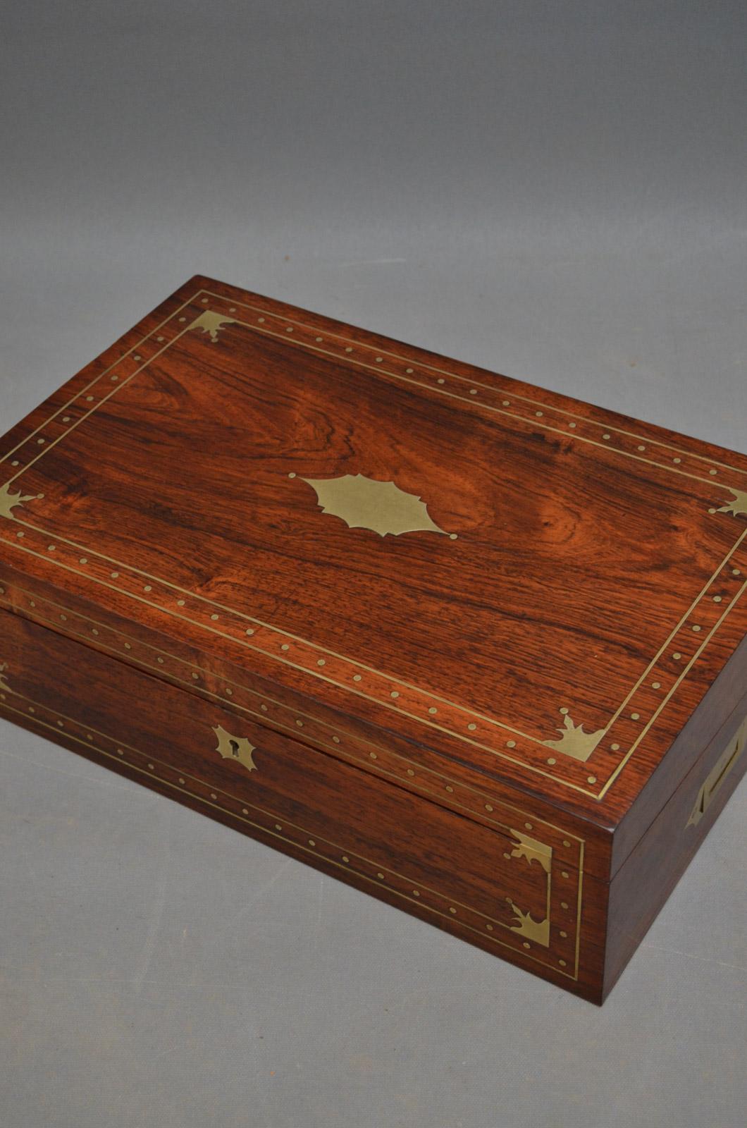 Sn3469, fine quality and very attractive, Victorian, rosewood writing slope with brass decoration throughout, hinged lit set with brass stringing and cartouche, enclosing velvet lined writing surface, pen tray and 3 secret drawers, concealed, brass