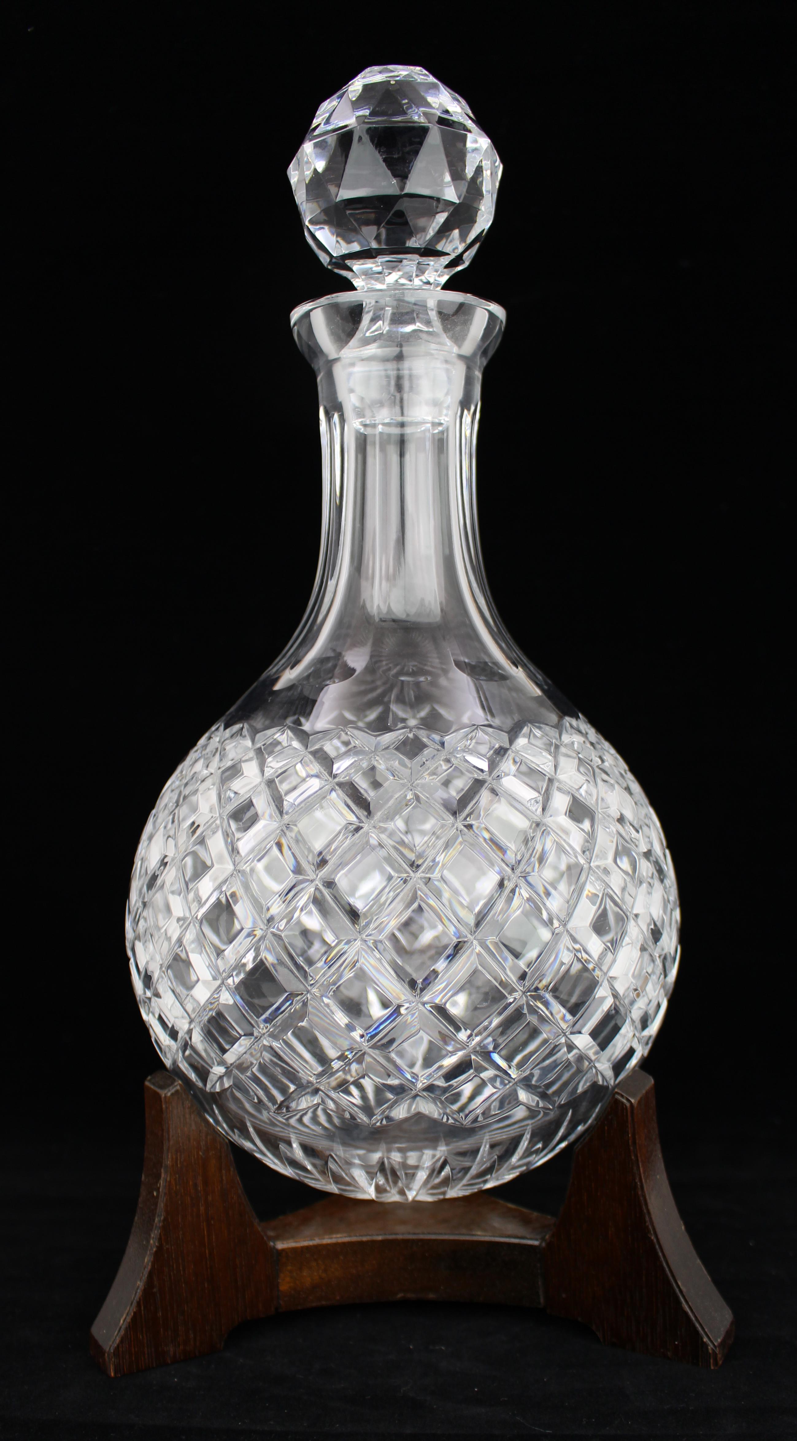 Fine Vintage Crystal Hogget Decanter on Stand

Mid-20th Century

A fine quality, very heavy cut-crystal hogget decanter, hand-cut with deep diamond decoration and fitted with its original multi-faceted stopper. The rounded base is designed to sit