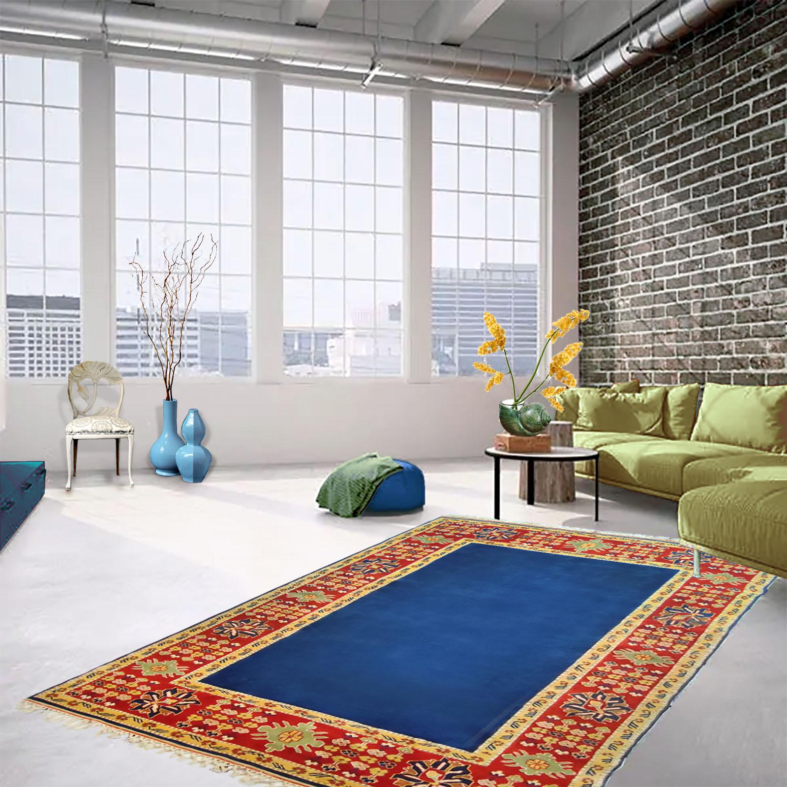 Fine vintage Gabbeh rug, hand knotted, made in Turkey, second half 20th Century.
Bold colors, blue, clean center, surrounded by a frame of geometric floral design, made of natural hand spun wool yarn and all the colors are created with natural plant