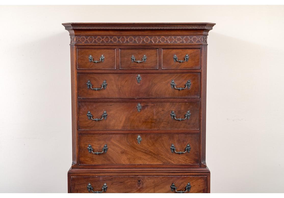 A large 1940’s Mahogany Chest with three small top drawers over six large drawers. The Chest has canted and fluted corners on the upper section with Greek Key banding at the top over a raised design beneath, ornate French style drawer pulls and key