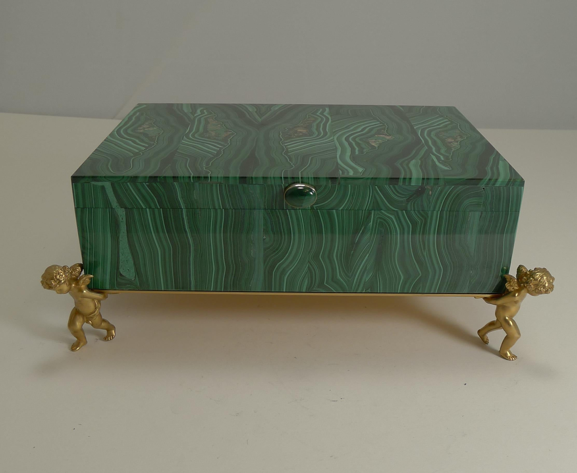 An absolute gem of a box, vintage in era dating to the mid-20th century and in superb condition, a truly magical jewelry box.

Highly graphic in the juxtaposition of malachite sections to create this high-quality intarsia. Fabricated in Russia of