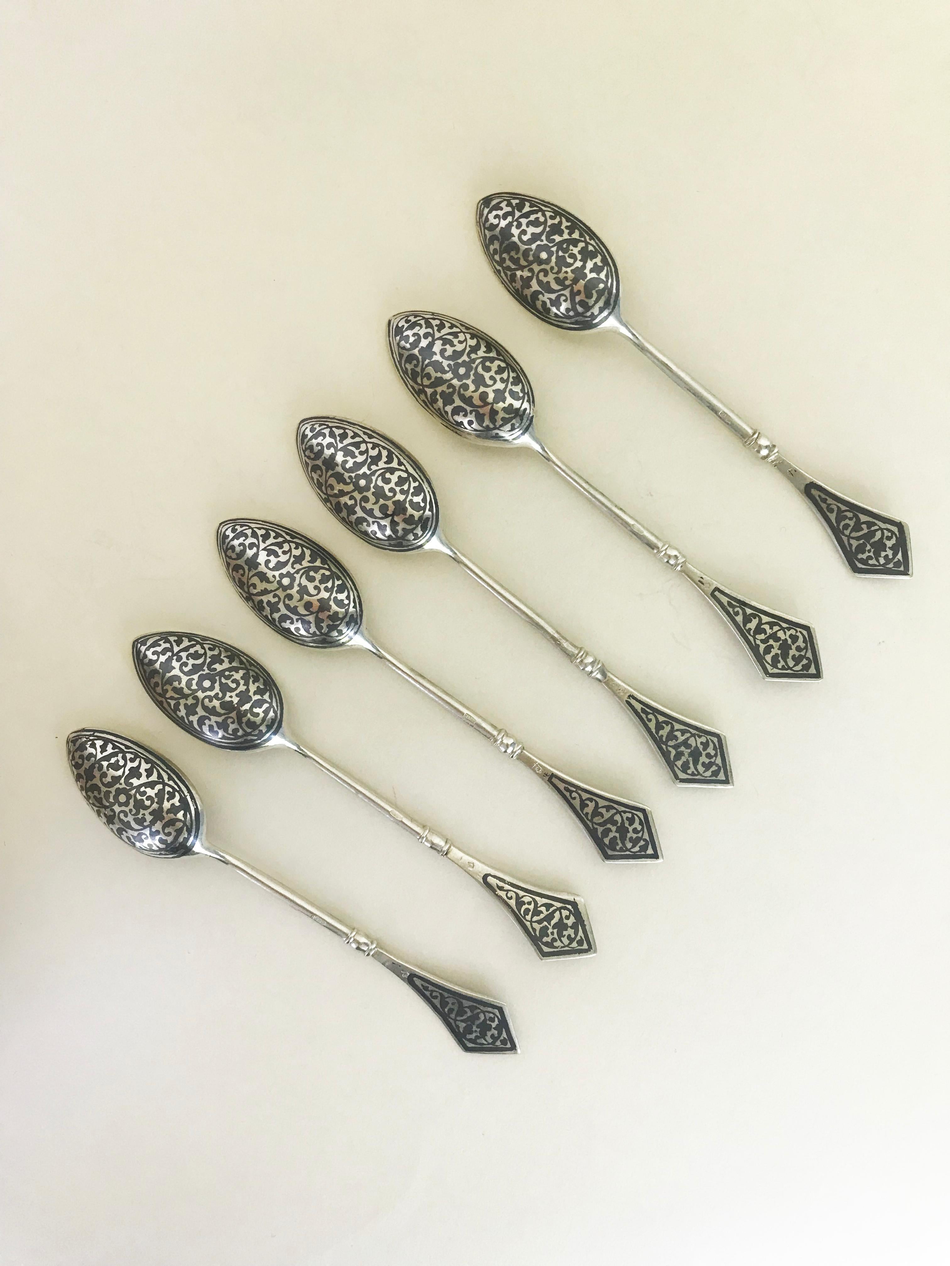 This beautiful and unique set of fine vintage silver - guilt niello Russian spoons are antique pieces from the 20th century. This set of six tea spoons are five inches in length and they are 24 grams of sterling silver. They are rare collection