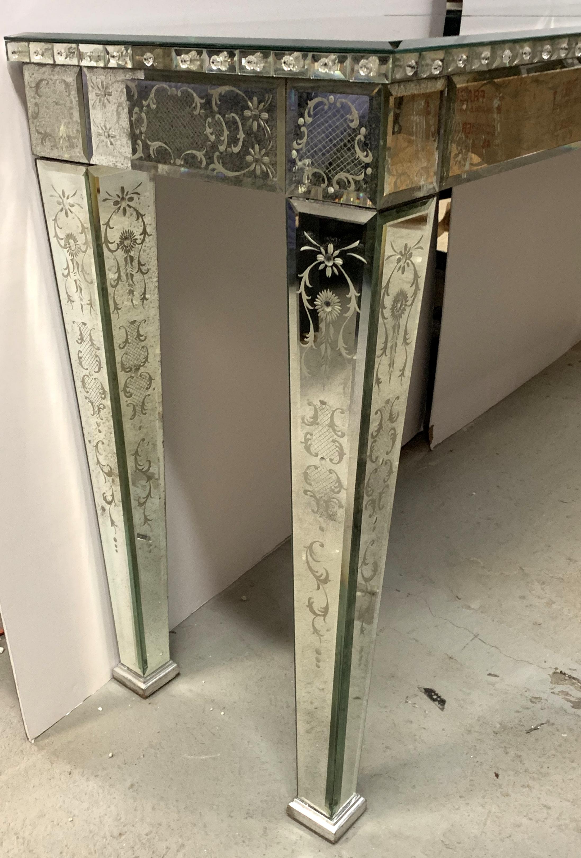 A very fine vintage Venetian etched and antiqued mirrored Italian large console table finished all the way around purchased from the world famous Lorin Marsh showroom.