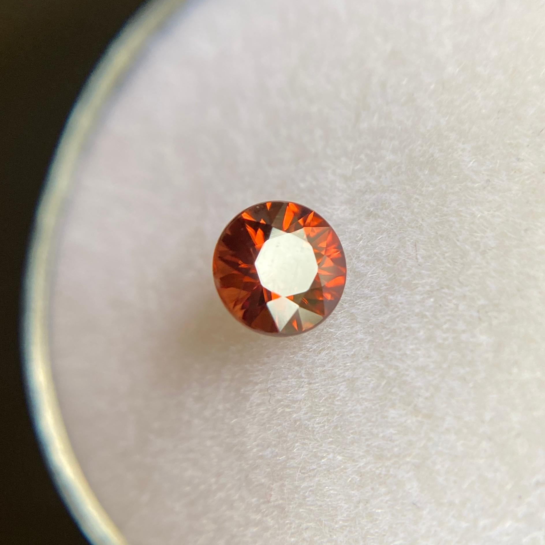 Fine Vivid Red Orange Zircon Gemstone.

0.71 Carat with a beautiful vivid red orange colour and excellent clarity. Very clean stone.

Also has an excellent round cut with good proportions and symmetry. Showing lots of brilliance, fire and light