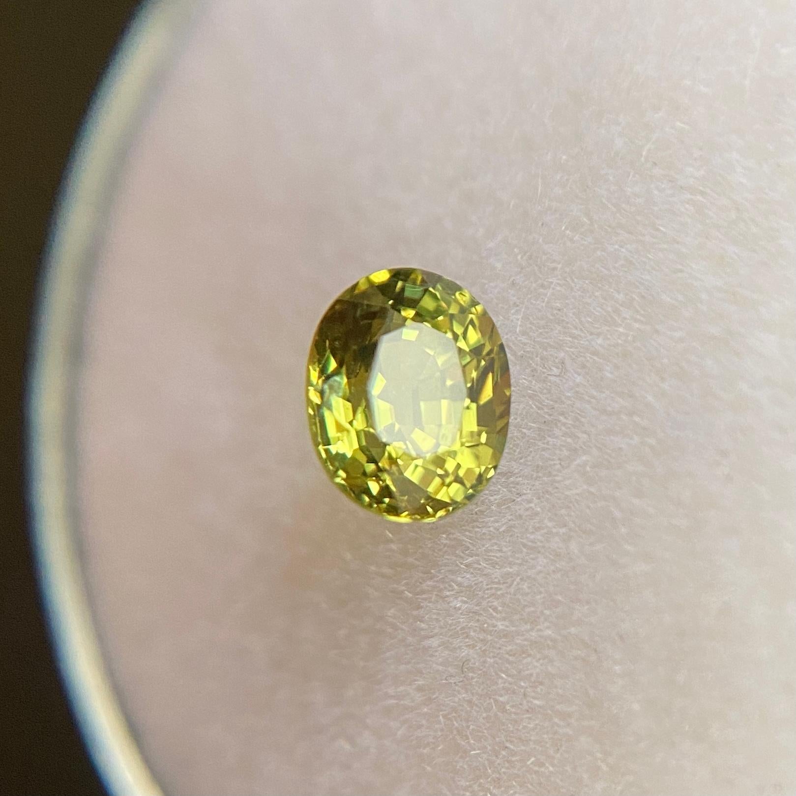 Fine Natural Untreated Yellow Green Australian Sapphire Gemstone.

0.80 Carat with a beautiful vivid yellow green colour and excellent clarity, a very clean stone.

Also has an excellent oval cut and ideal polish to show great shine and colour,