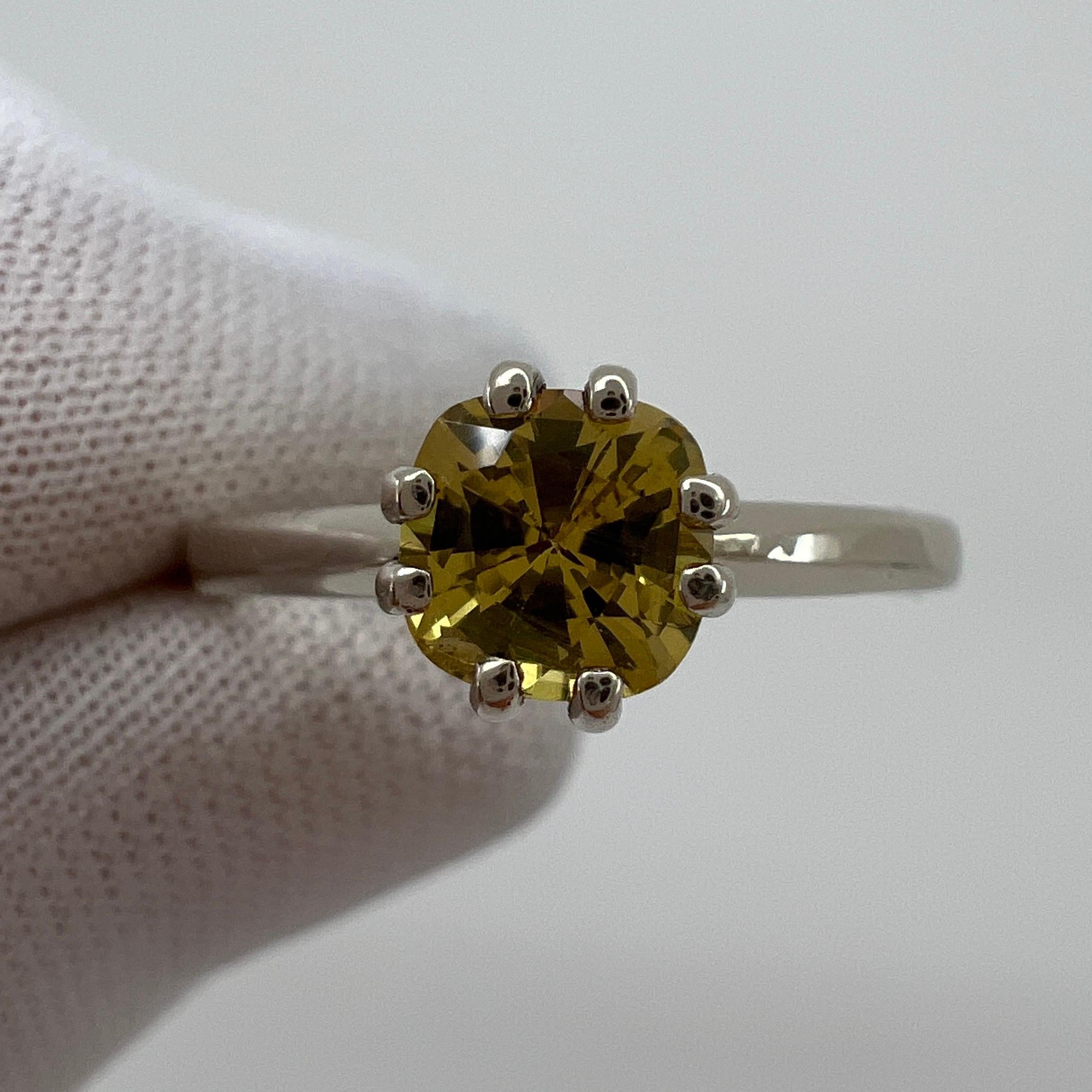 Fine Vivid Yellow Orange Sapphire Cushion Cut White Gold Solitaire Ring.

Stunning bright yellow-orange sapphire with a fine vivid colour and superb 'ideal' cut. Set in a beautiful 14k white gold solitaire ring.

0.70 Carat stone with excellent