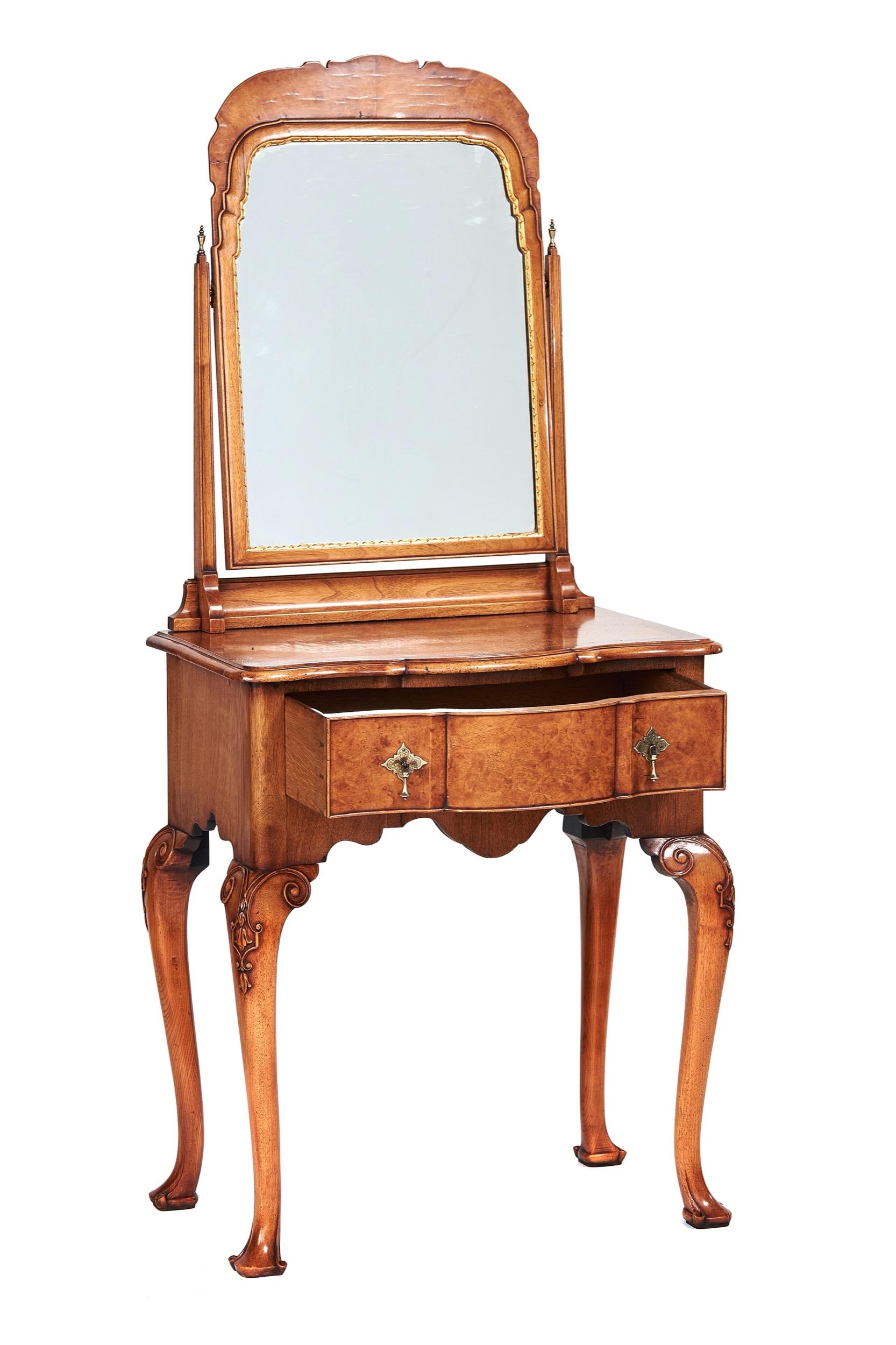 Fine Walnut & Burr Walnut  Lowboy  Dressing table,
 Queen Anne Revival circa 1920s
Arch Shaped Swing mirror, Swivels on ball with pinch screws.
Tapering Supports each side with urn shaped Brass Finials, 
Mirror with Gilt carved moulding around