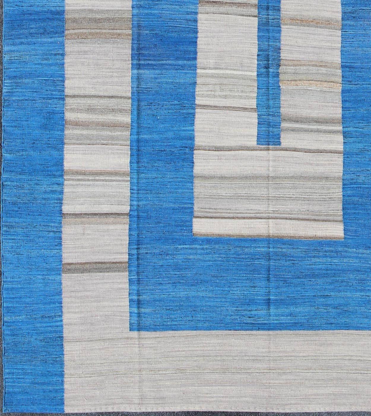 Afghan Kilim rug with large modern pattern in cobalt blue and gray, Keivan Woven Arts / rug orn-31251, country of origin / type: Afghanistan / Kilim.

This Afghan Kilim has a large-scale, modern pattern set on a vibrant cobalt blue