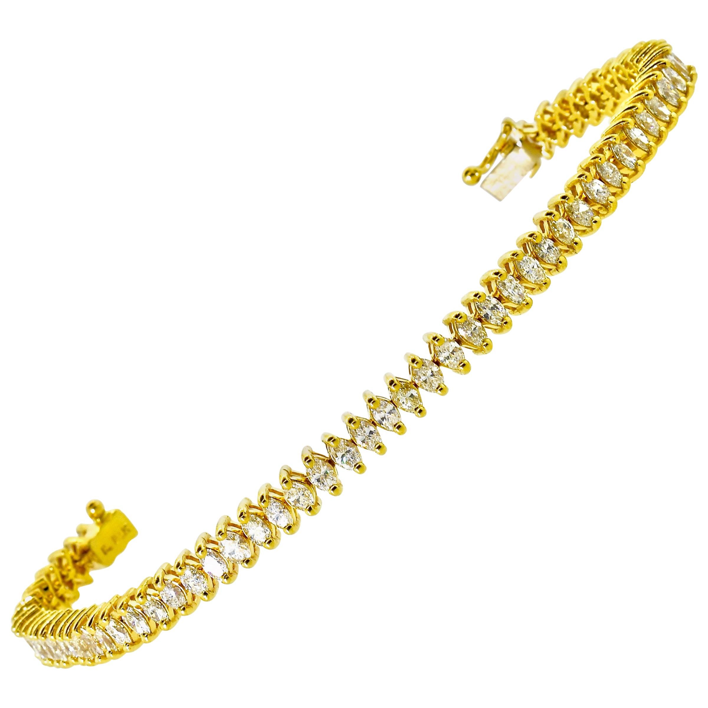 Diamond and gold well made contemporary bracelet possessing 63  well cut and finely match marquis diamonds.  These diamonds are estimated all to be near colorless (H), and very slightly included (VS).  The total weight is 3.75 cts. This highly