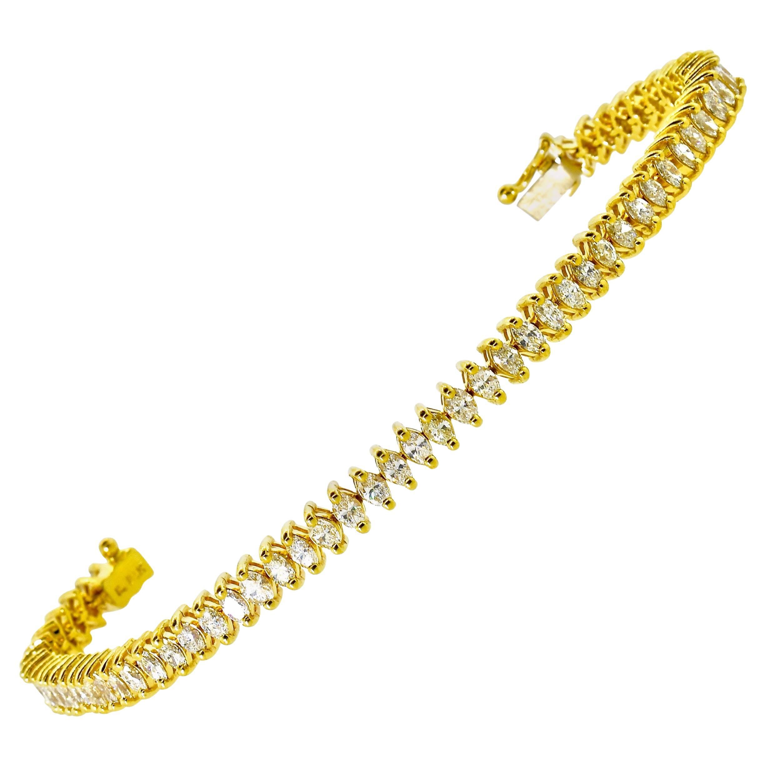 Diamond and gold well made contemporary bracelet possessing 63  well cut and finely match marquis diamonds.  These diamonds are estimated all to be near colorless (H), and very slightly included (VS).  The total weight is 3.75 cts. This highly