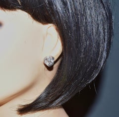 Fine White Diamond Stud Earrings in White Gold Earrings with a Love Knot Motif.