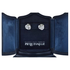 Fine White Diamond Stud Earrings in White Gold Earrings with a Love Knot Motif.