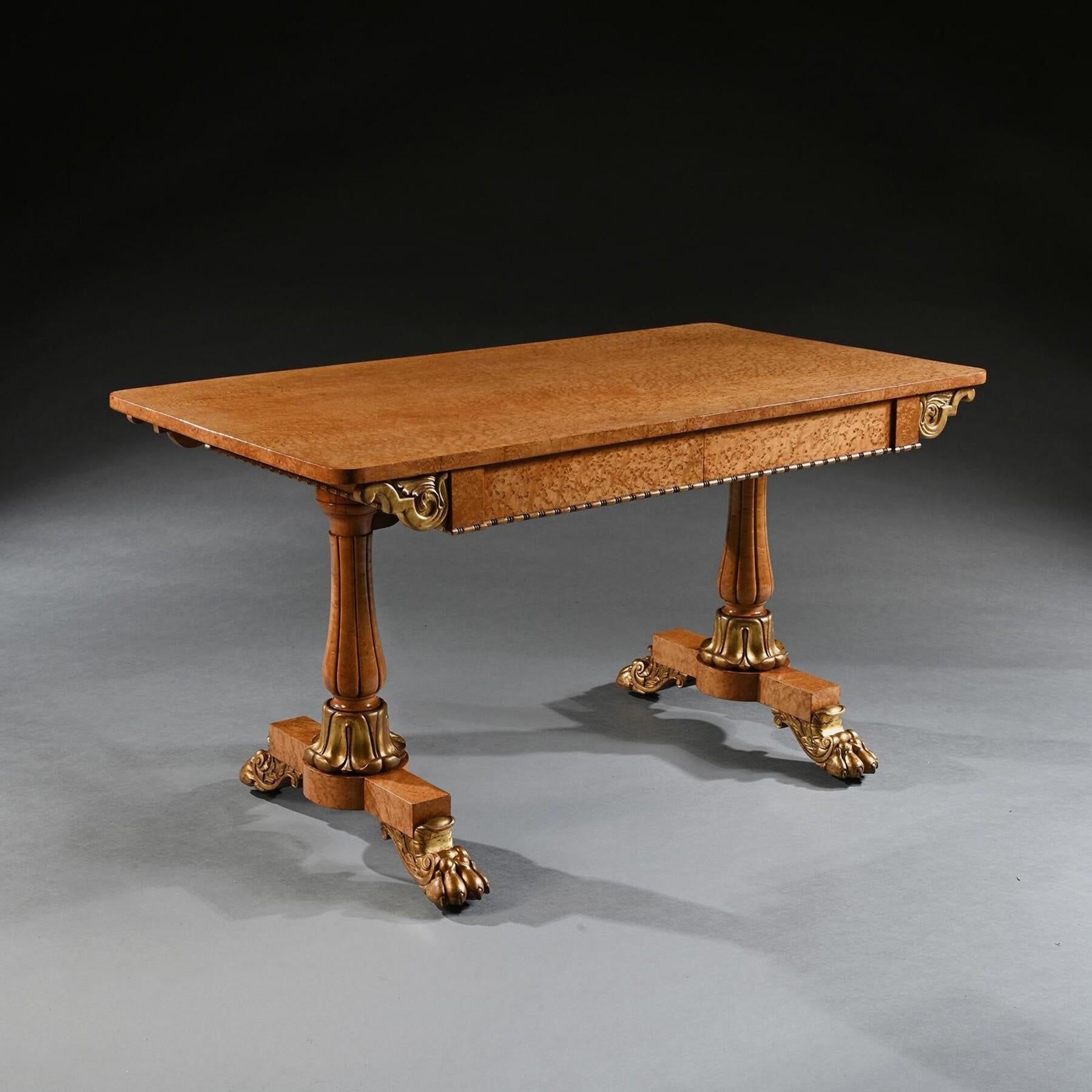 An Elegant William IV Birdseye Maple and Carver Giltwood Library / Centre or Sofa Table  

English Circa 1830

This distinctive library or centre table of birdseye maple and carved giltwood portrays an impressive appearance. The superior