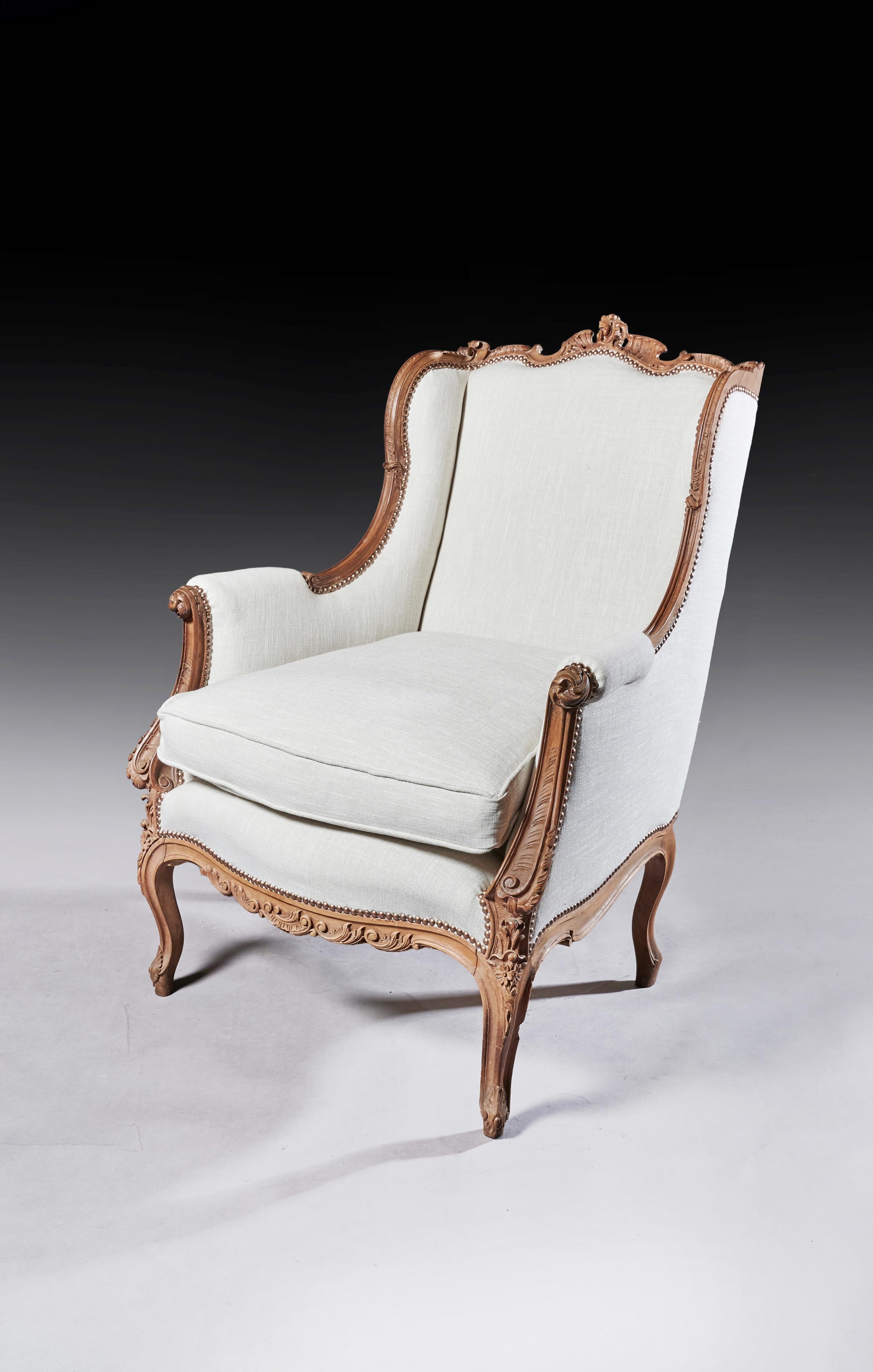 Linen Finely Carved 19th Century French Louis XV Style Wing Armchair