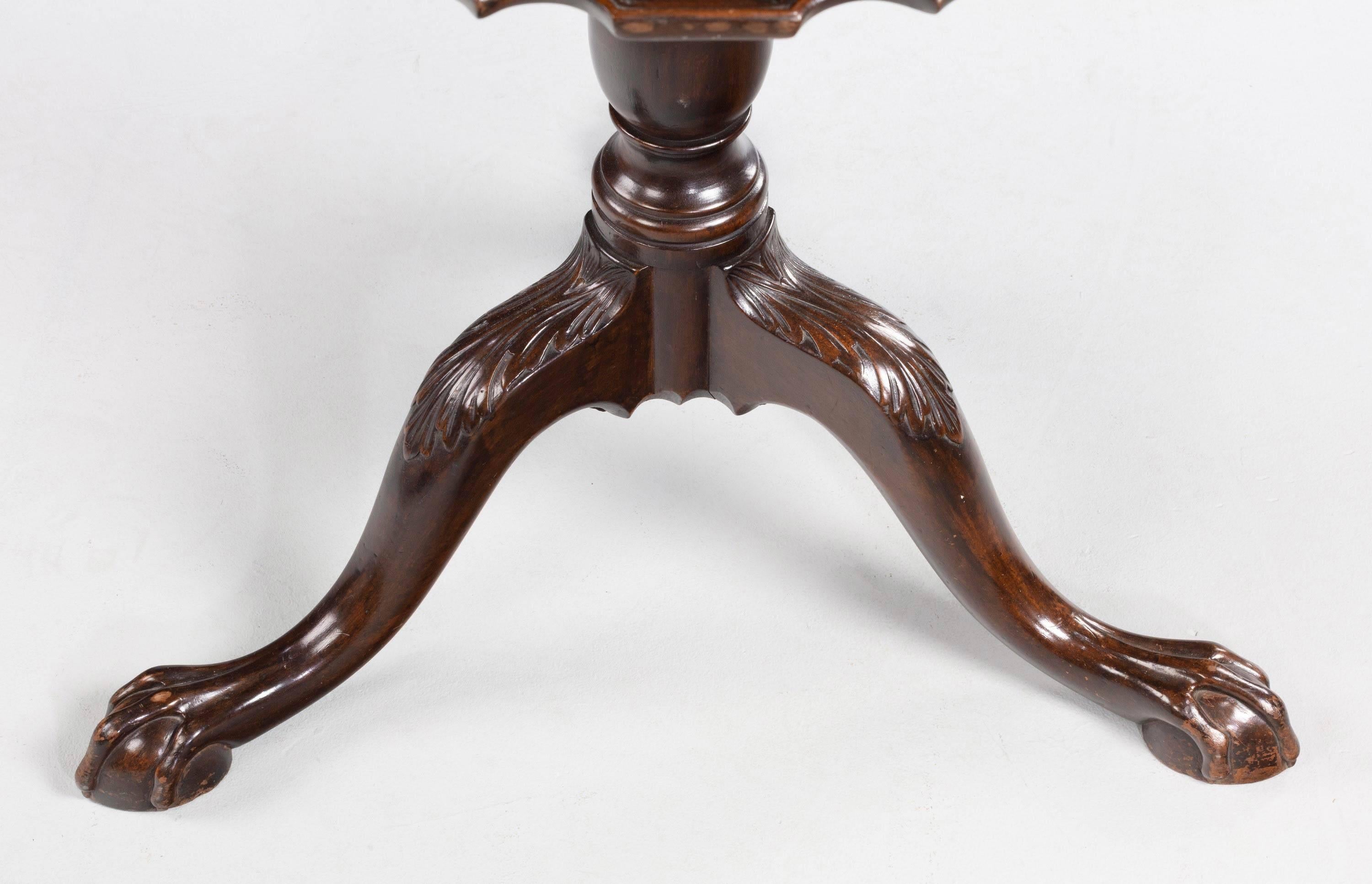 A very finely carved Chippendale style mahogany pie-crust tilt table. Overall color and condition are excellent.
 