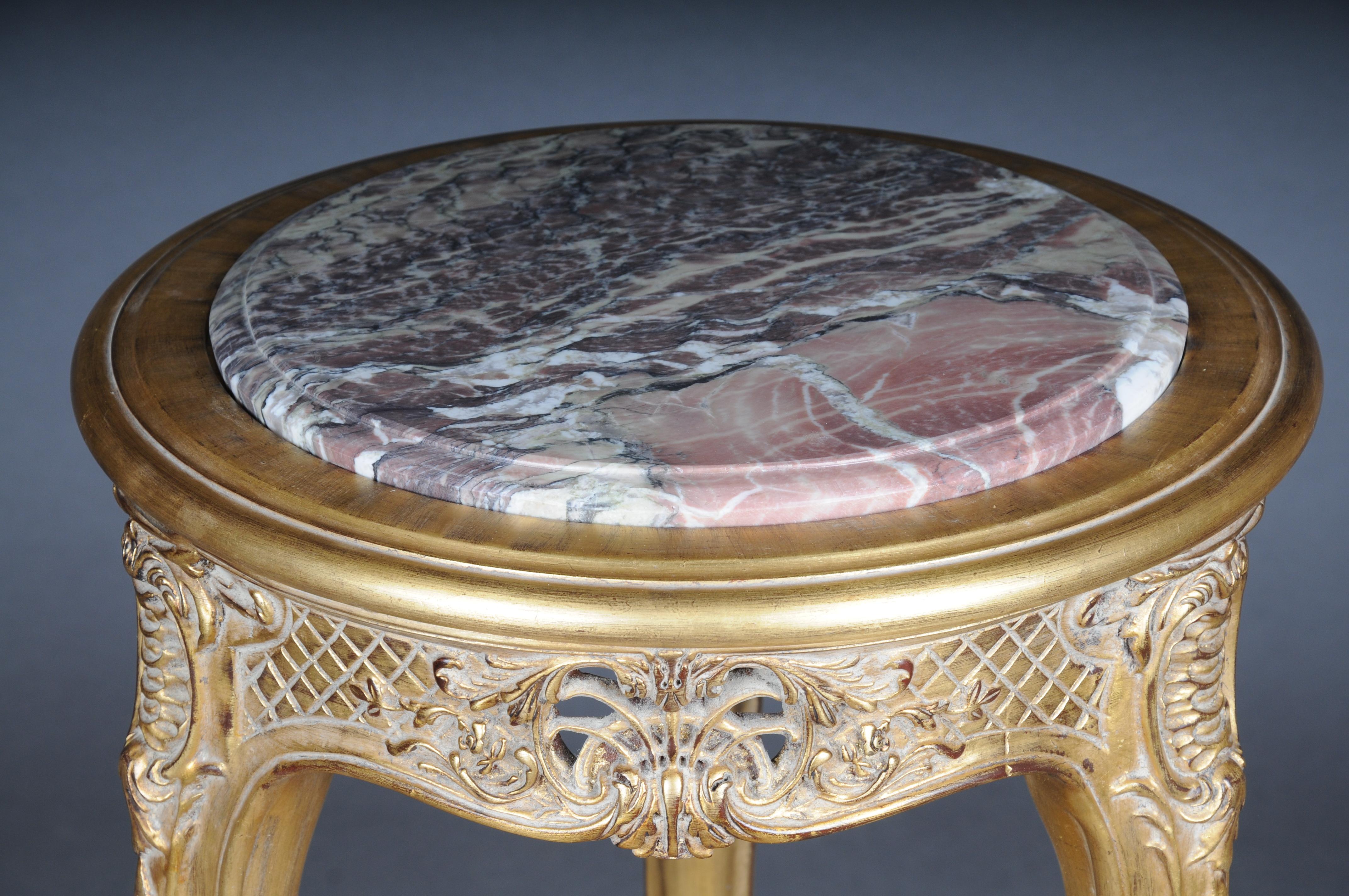 Finely carved gold side table with marble top, Louis XV

Excellent French Louis XV style table.
High-quality, solid beech wood, carved down to the smallest detail. Extremely decorative and noble. Round inserted and profiled marble slab which is