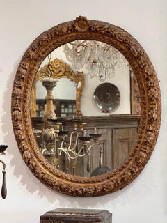 Finely carved Louis XIV period oval mirror, 18th century