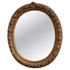 Finely carved Louis XIV period oval mirror, 18th century