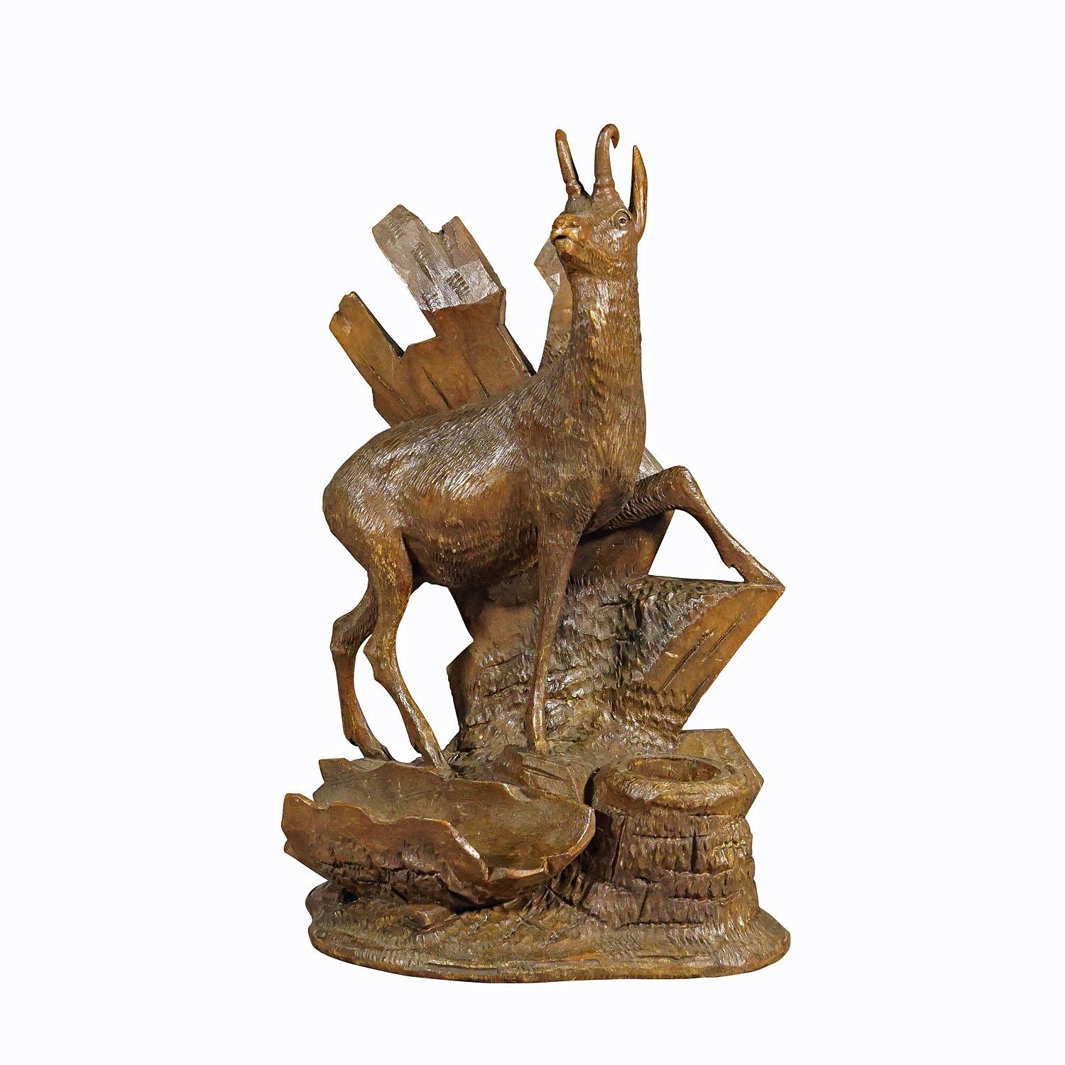Finely carved wood chamois Brienz, Switzerland circa 1900.

A delicately handcarved wood sculpture of a chamois standing on a rocky base. A very detailed and natural carving excecuted by one of the Swiss woodcarvers from the area of Brienz, ca.