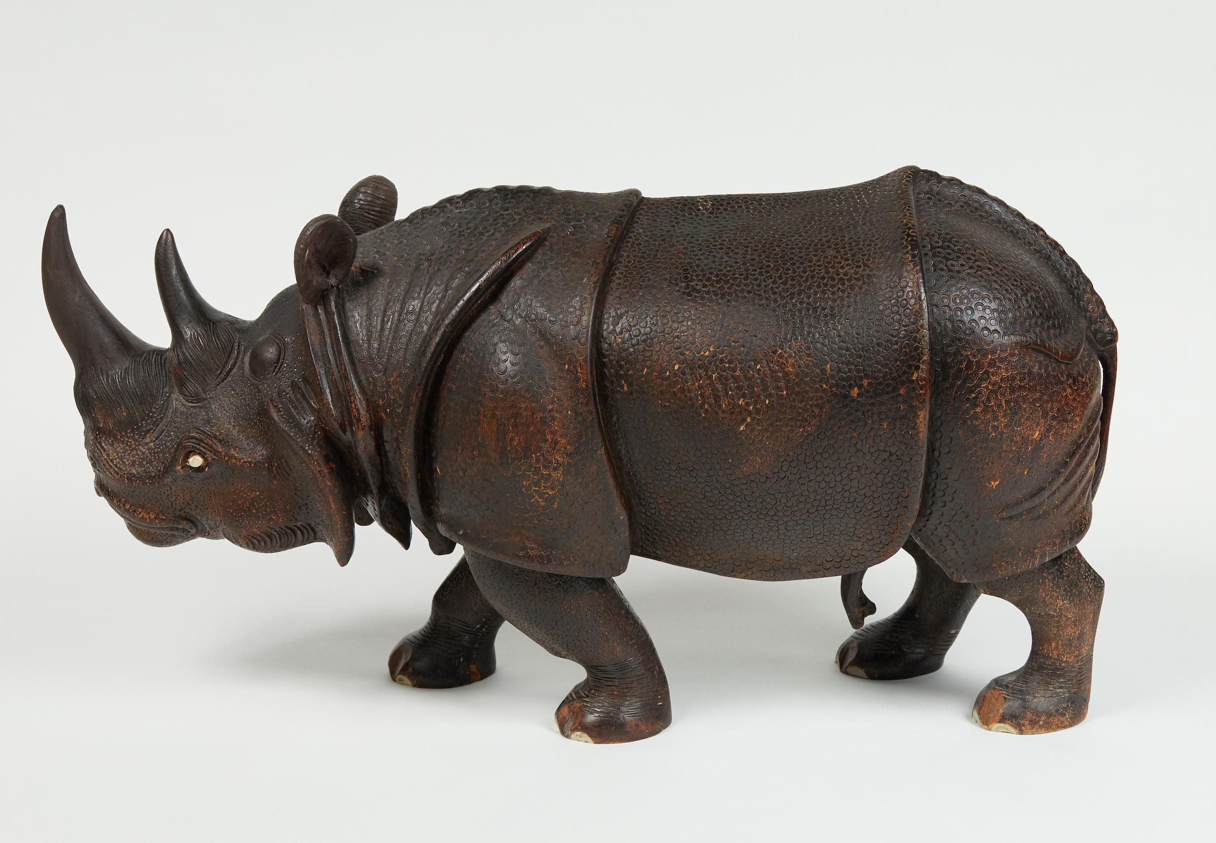 Finely carved wood Indian Rhino sculpture.