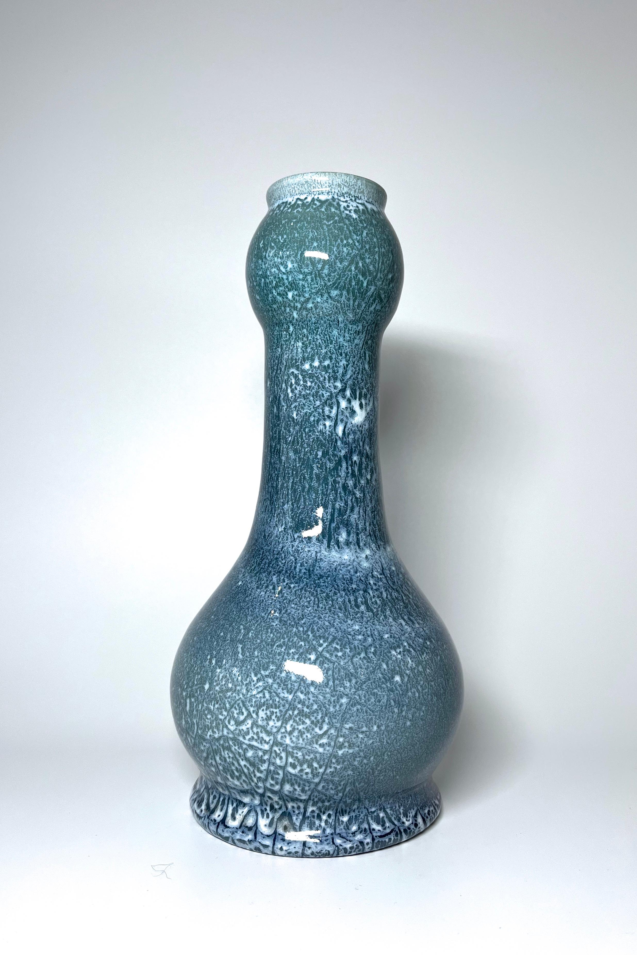 Shades of pale blue, grey and white, all combine and provide a fascinating crackle glaze to this superbly crafted piece
Out of the common shaped tall ceramic vase from Accolay, France
Circa 1960's
Signed Accolay JK to base
Height 9.5 inch, Diameter