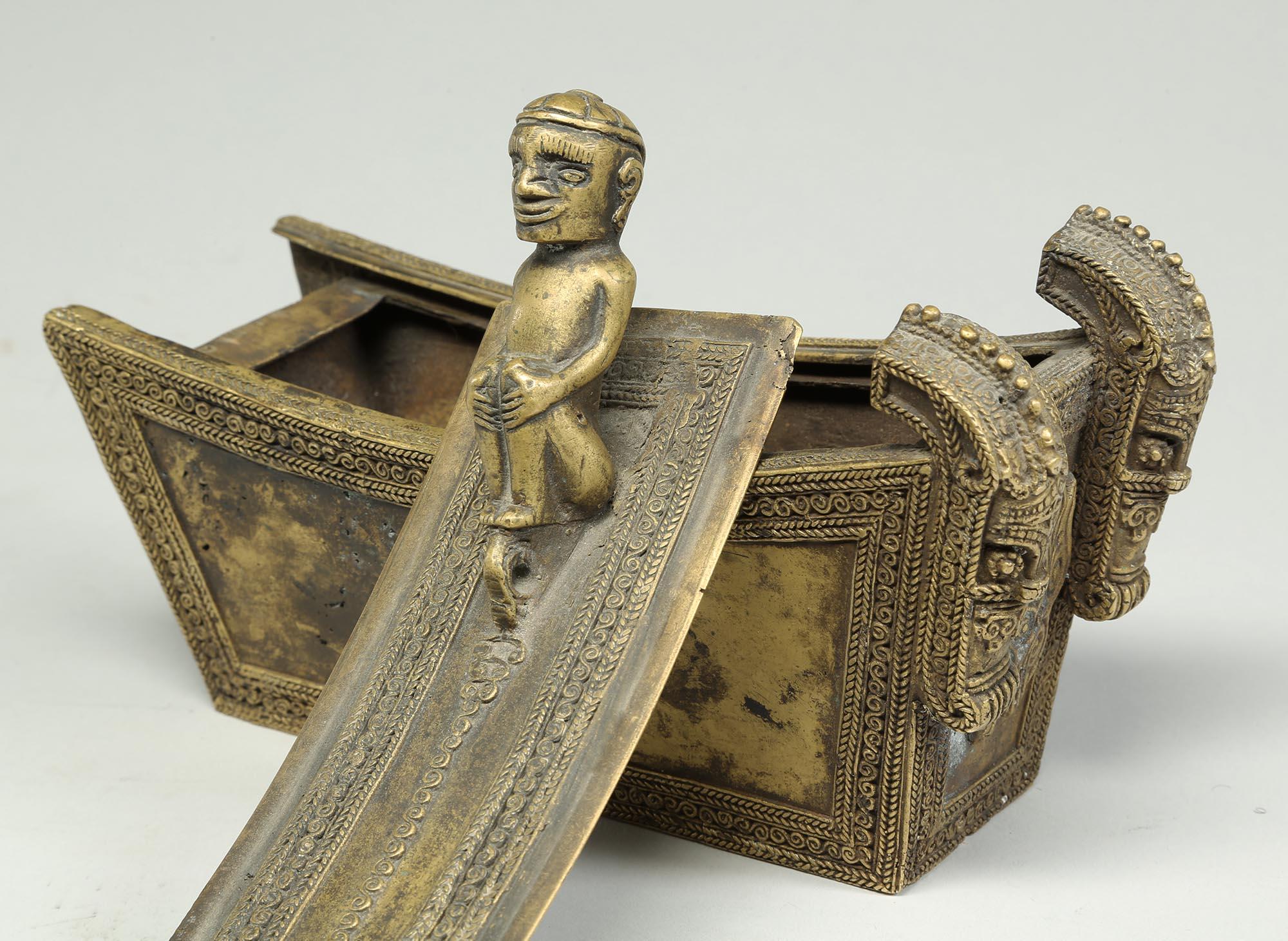 a small bronze box with