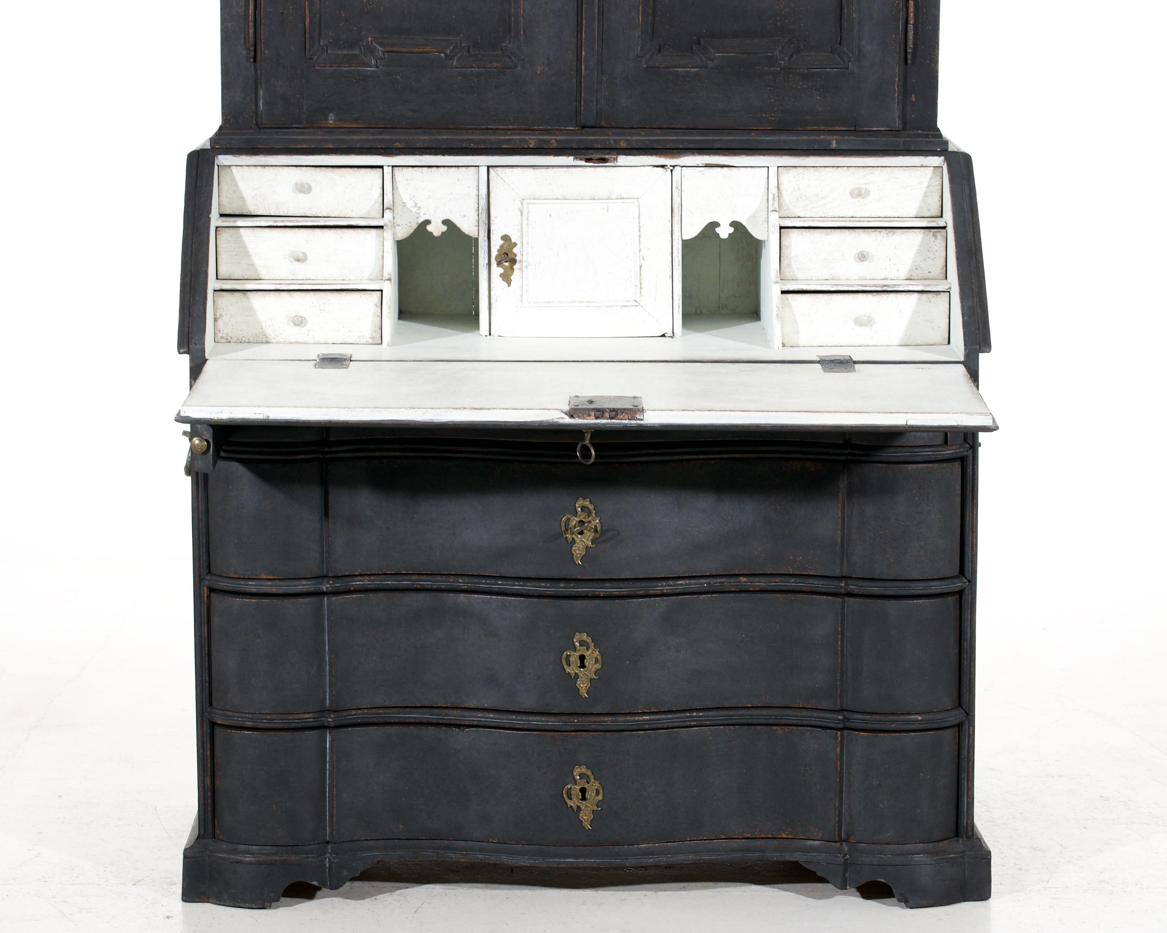 This finely crafted two-part bureau, circa 1750, was made in Sweden and features original locks and side handles. It is a beautiful example of Swedish craftsmanship. This bureau is a unique and highly desirable piece.