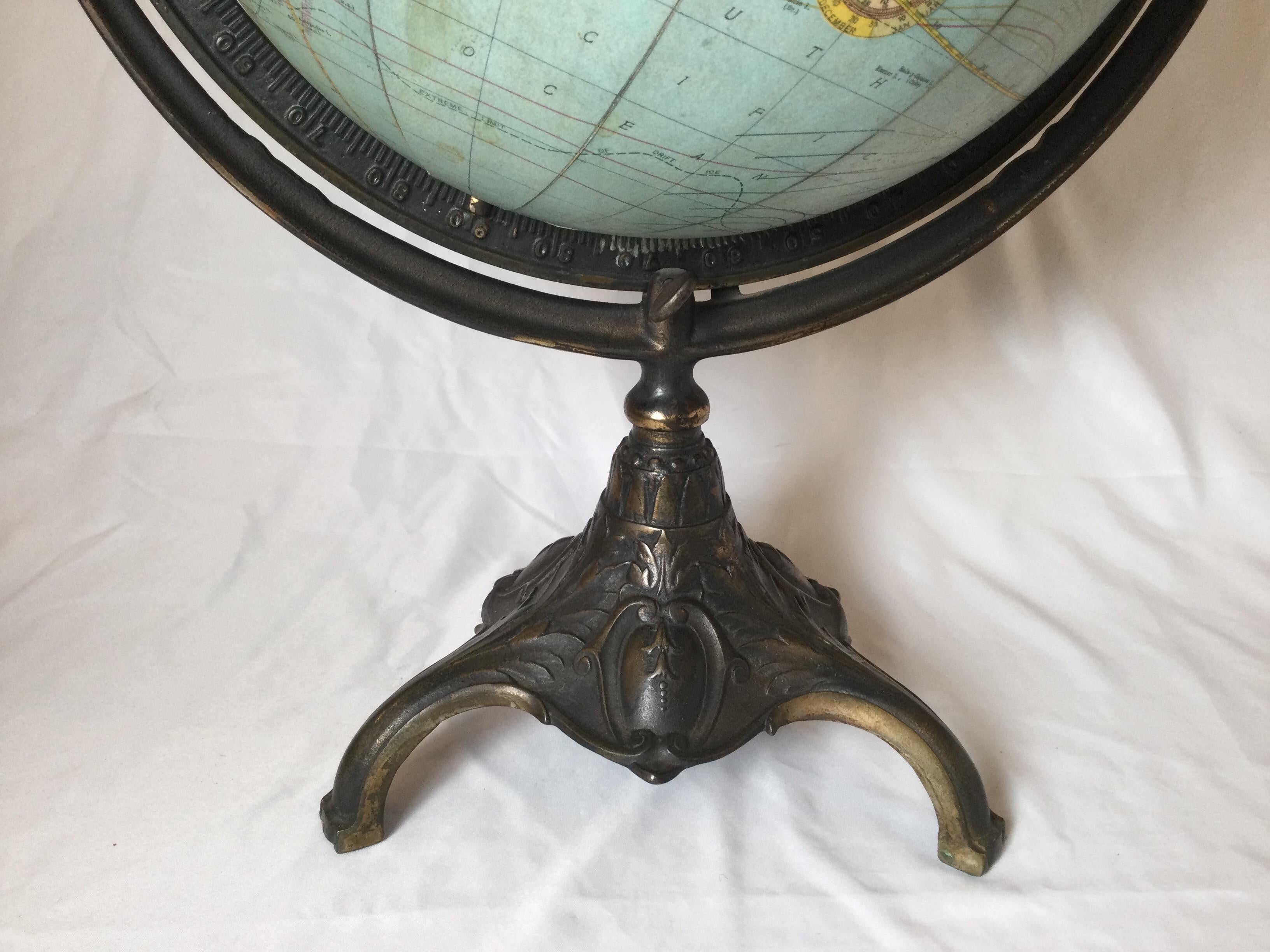 Finely detailed antique Rand McNally & Co. Terrestrial tabletop globe 12”.
Beautiful bronze finish nouveau style base. Wear consistent with age. Some minor loss of paper detail around wood “equator”. Small ding by label. See photos for