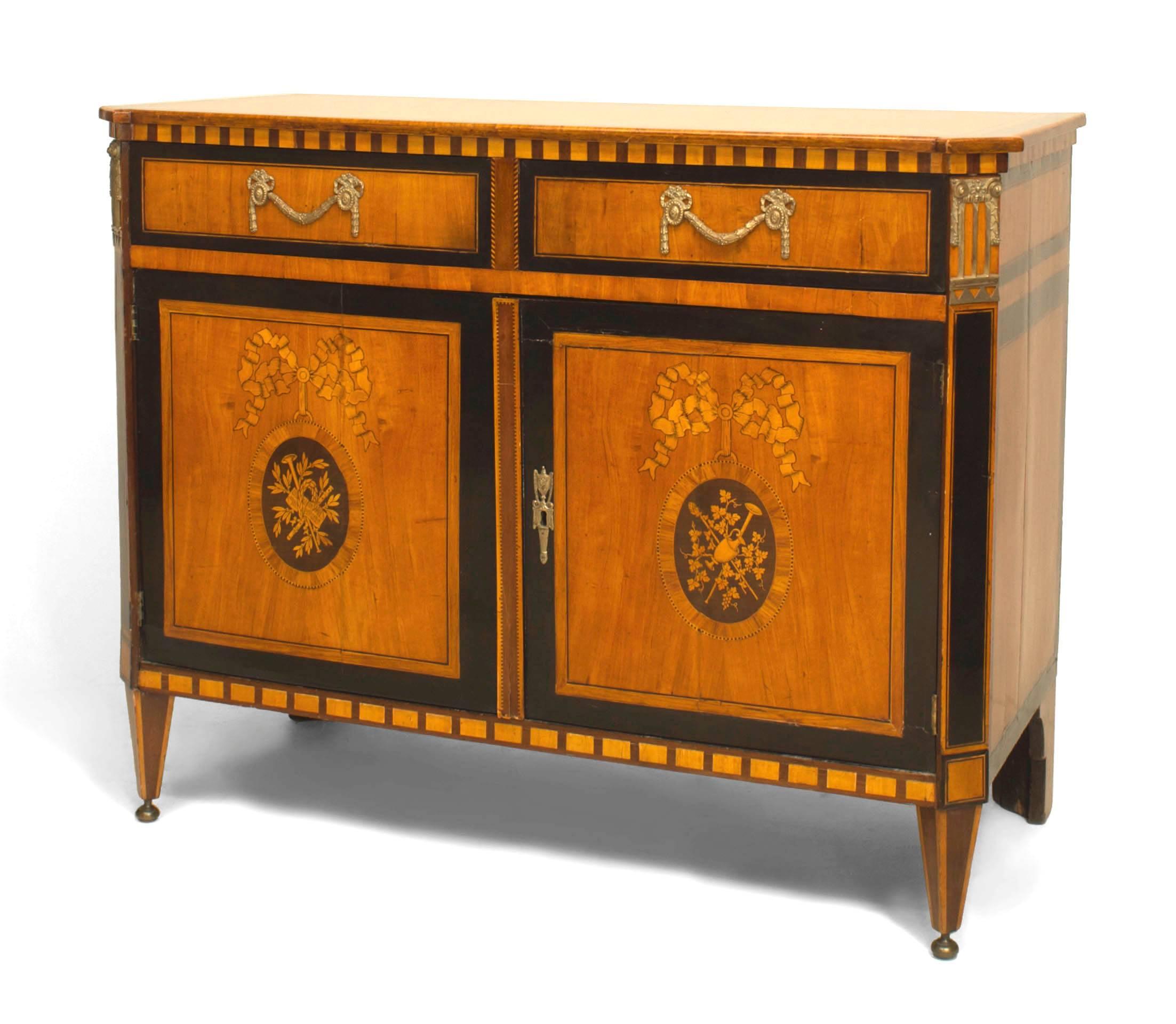 Continental Dutch (18th/19th Century) satinwood commode cabinet with 2 drawers above to doors with floral marquetry panels.
